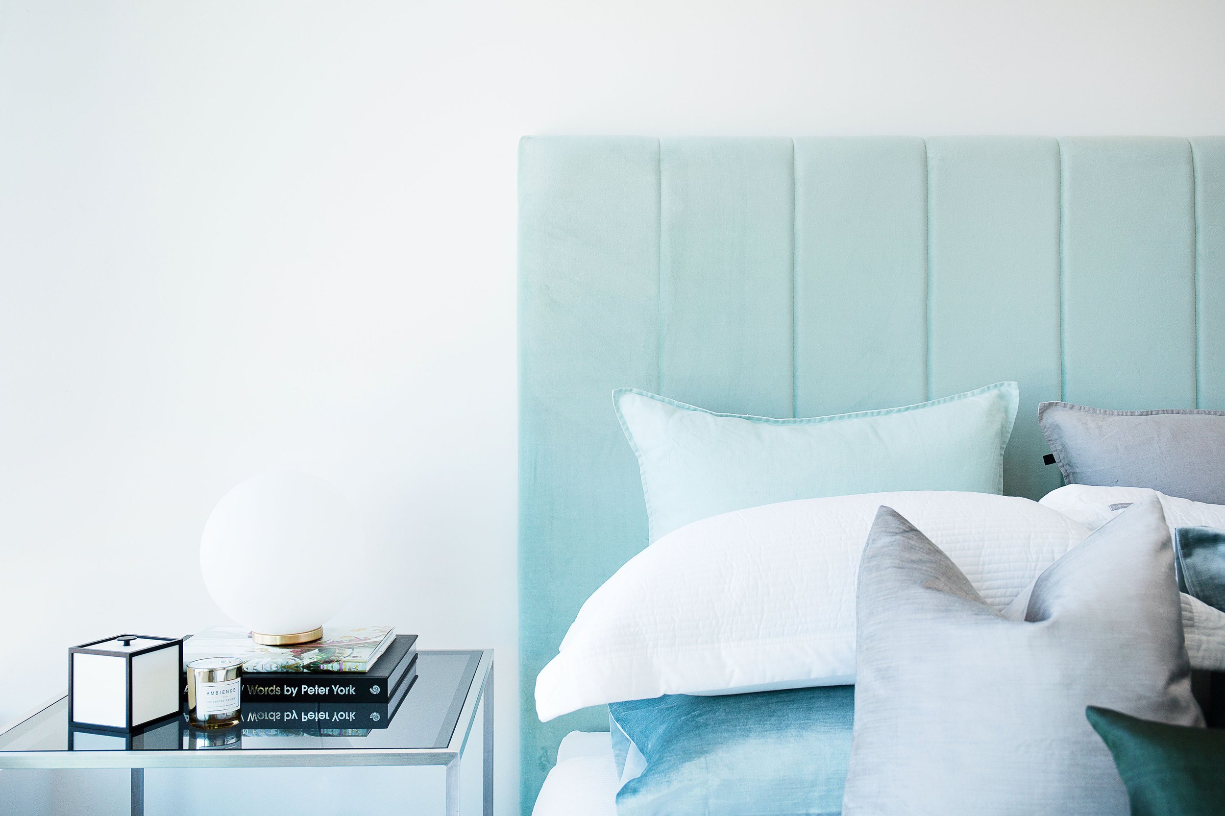 Styled bedside table with lamp and accessories in Forge by Mirvac apartment 1057, Docklands.