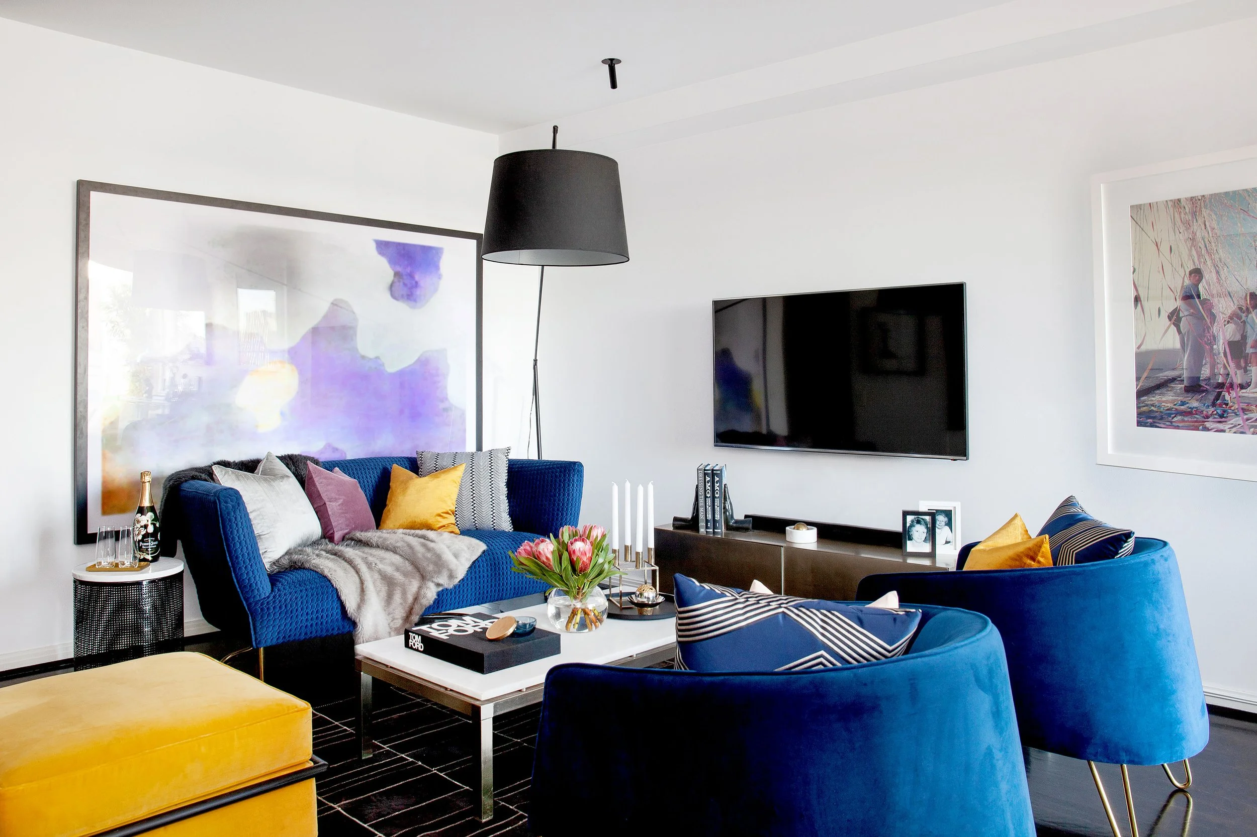 Spacious modern lounge with layered textures and curated furniture