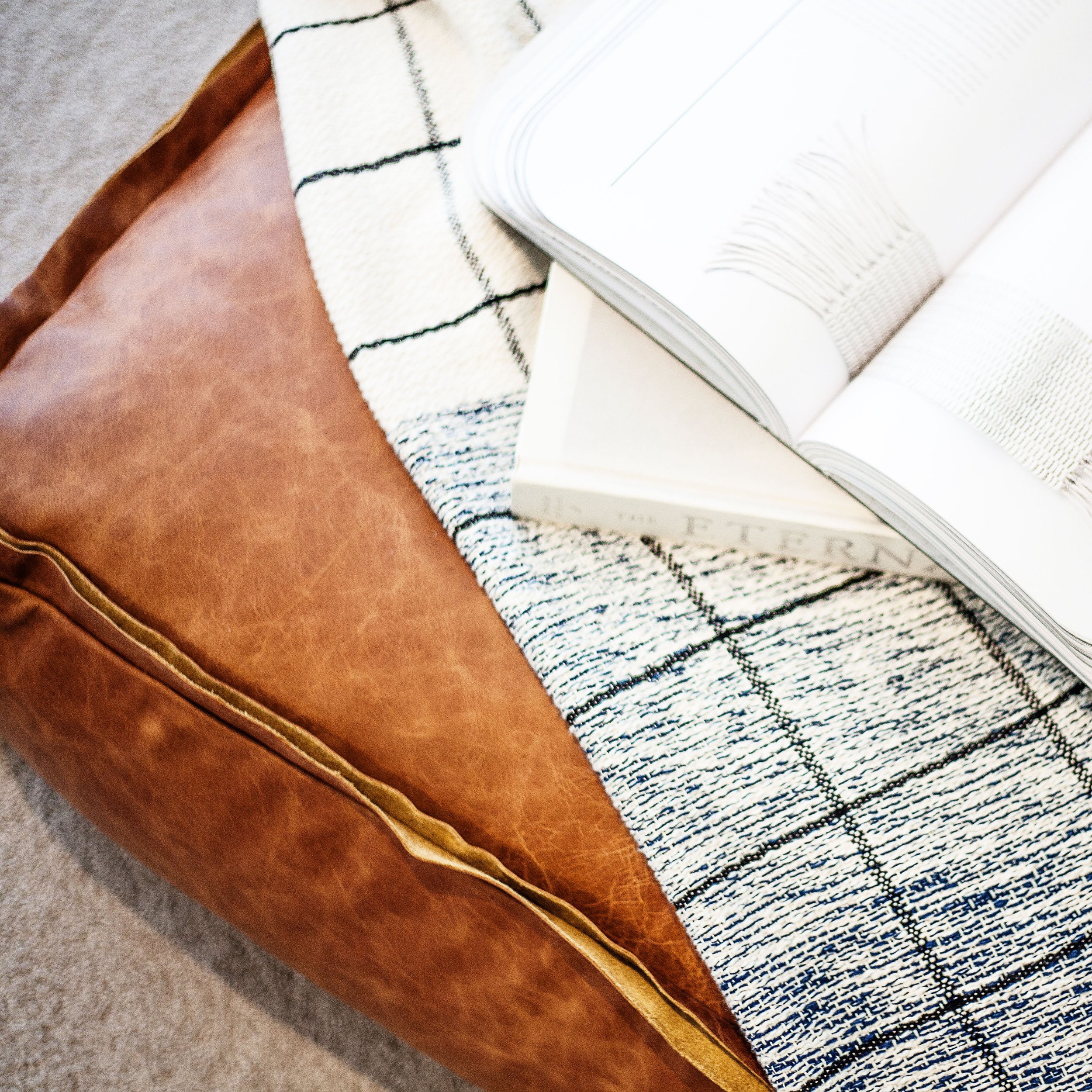 Leather upholstery detail in Forge Docklands Apartment 204 highlighting warm material contrast within the interior styling.
