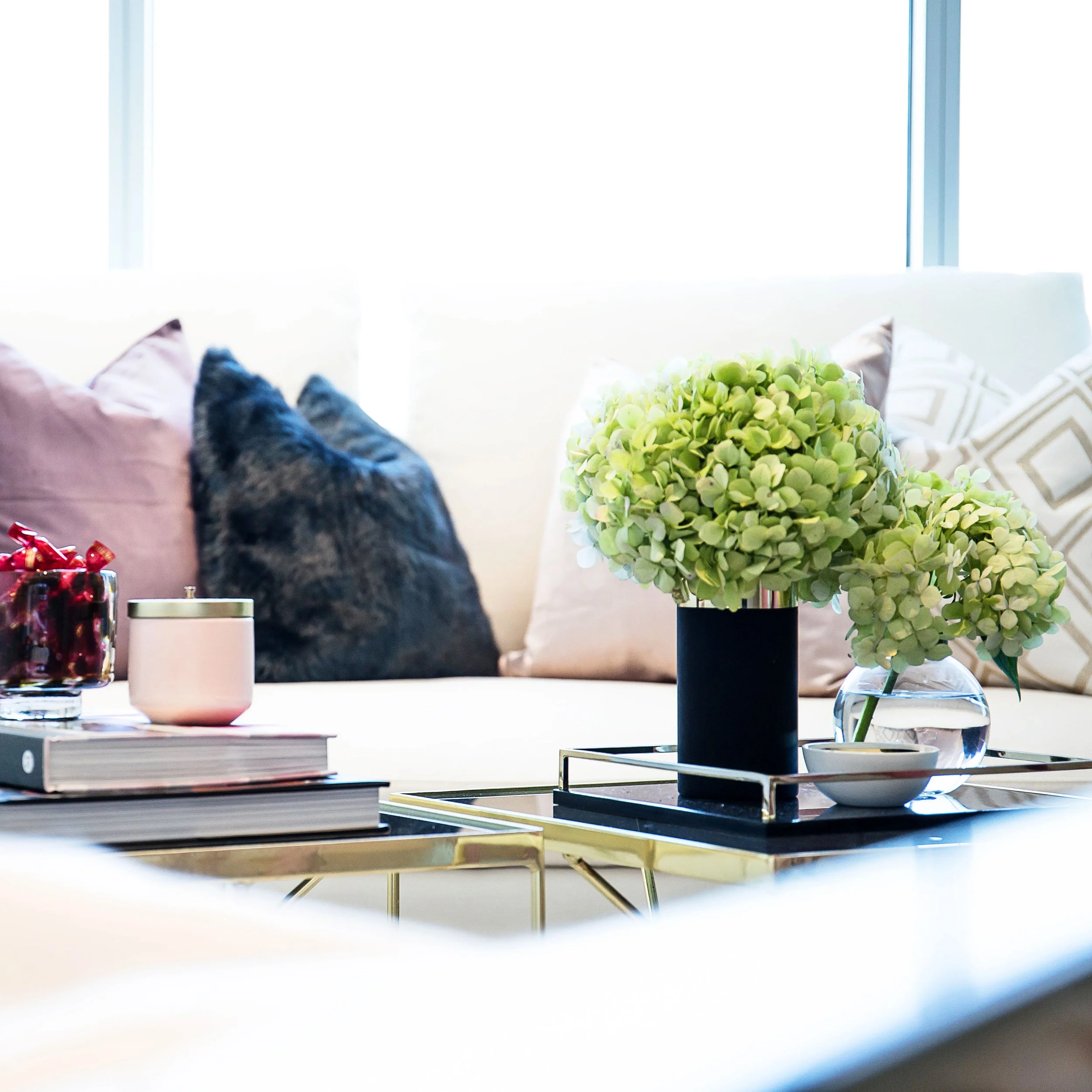Styled coffee table with books and accessories in Forge Docklands apartment 1057.