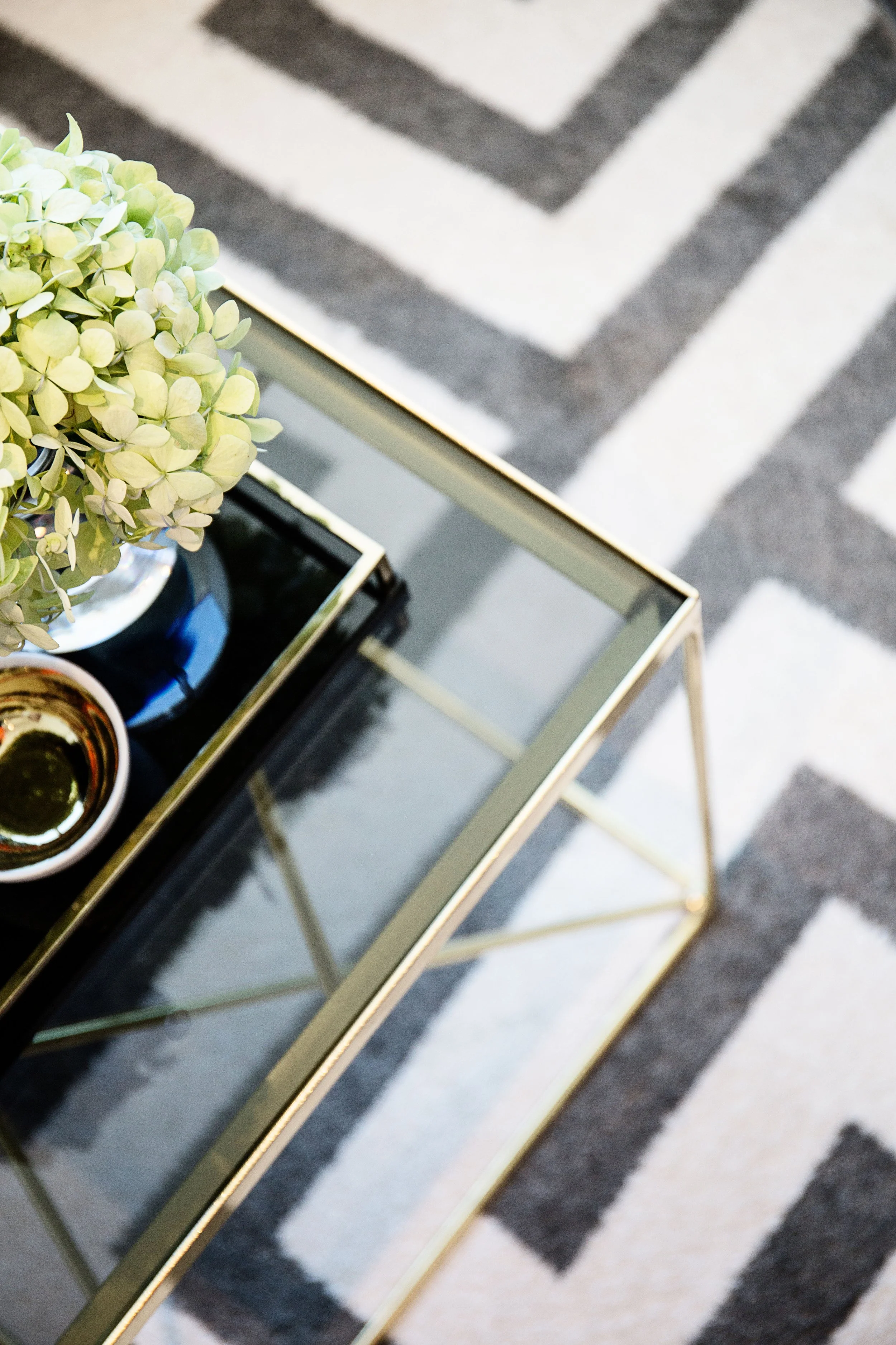 Coffee table styling detail with books and decor in apartment 1057 at Forge Docklands.