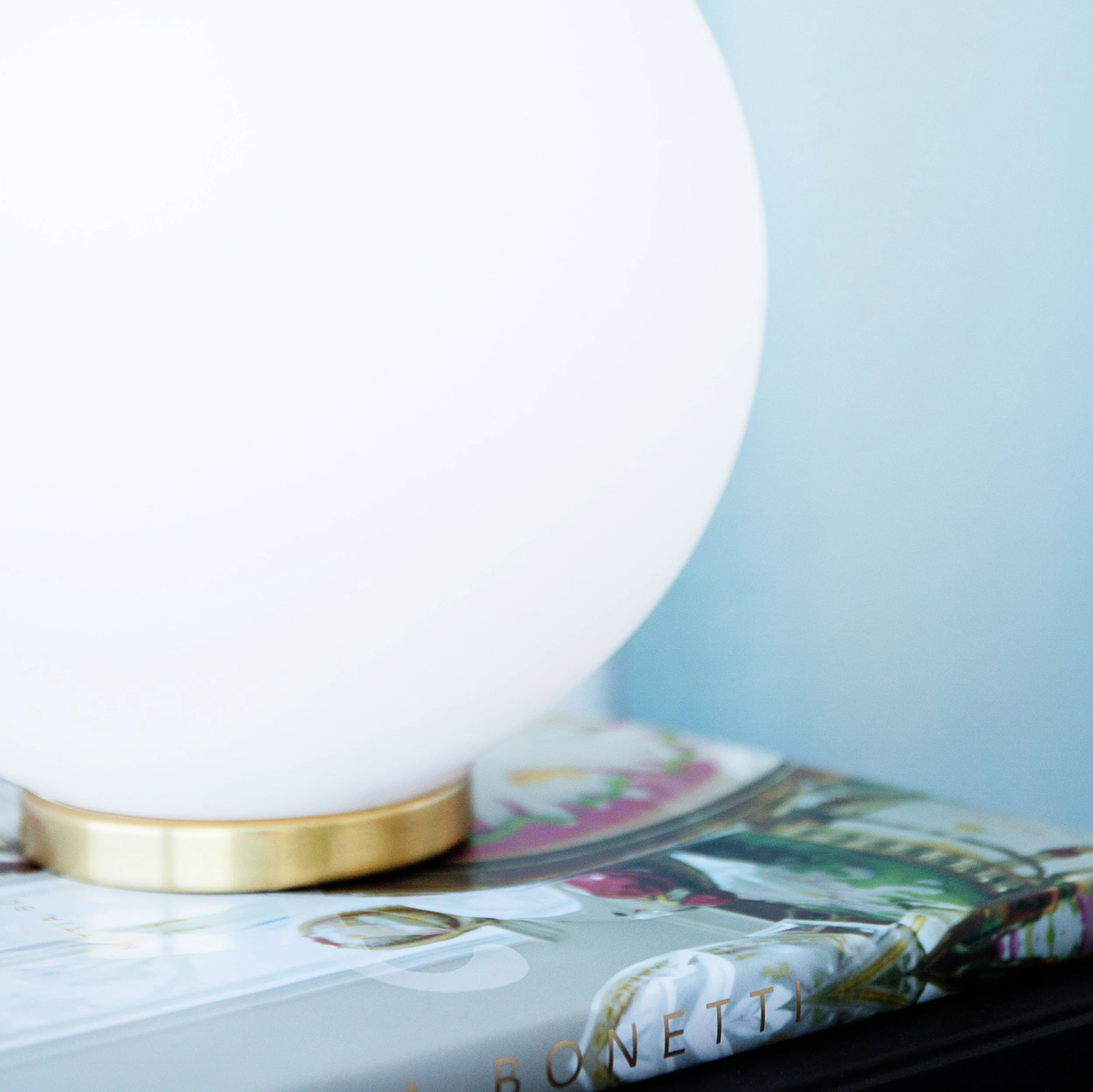 Styled bedside table with lamp and accessories in Forge by Mirvac apartment 1057, Docklands.