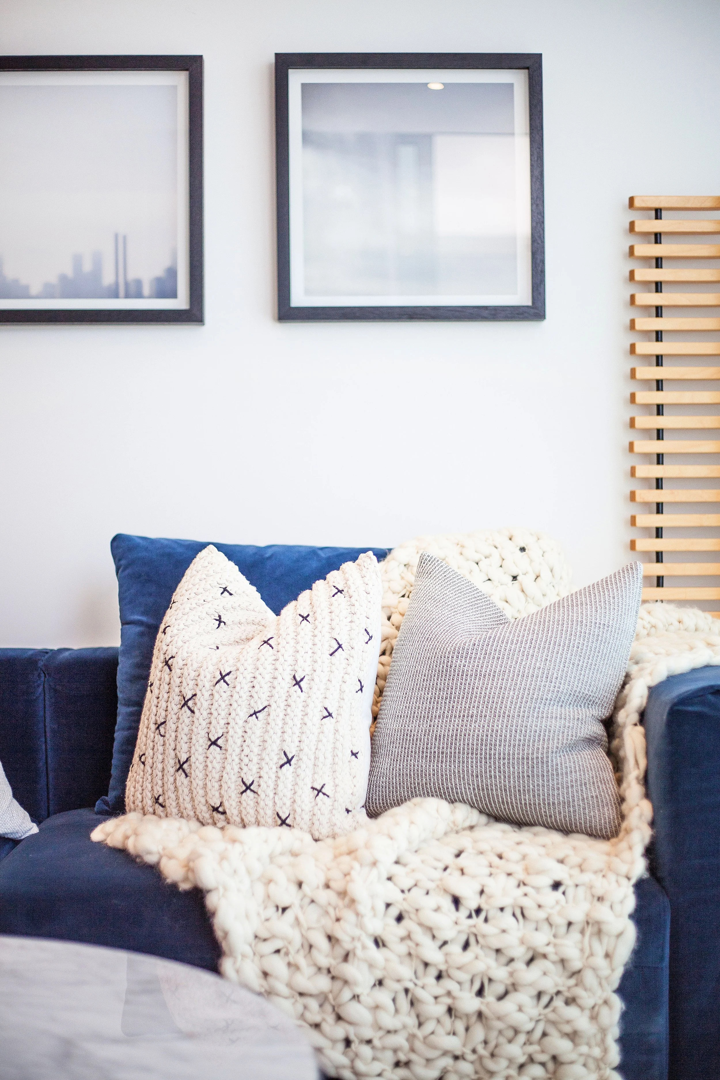 Framed artwork and interior styling detail in the living room of Forge Docklands Apartment 204.