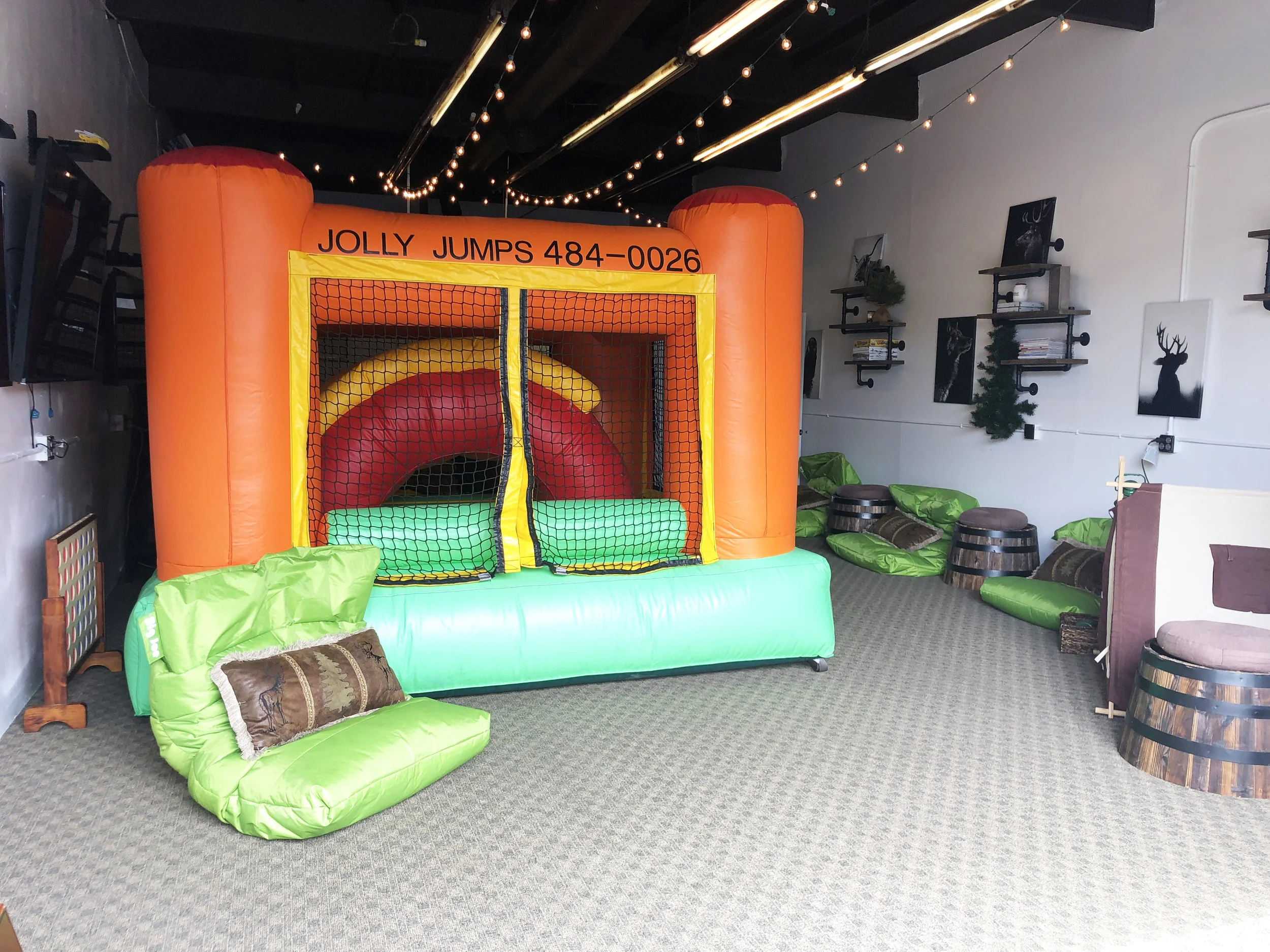 Jolly Jumps bounce house setup at The Papa Saloon