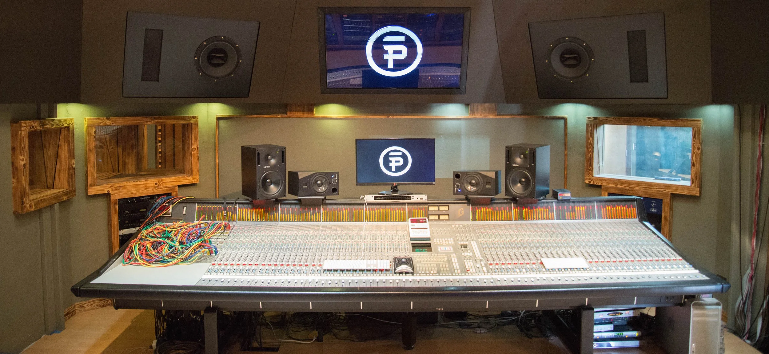 Synergy Productions control room featuring Solid State Logic 4064 G Series mixing console with Ultimation and Total Recall
