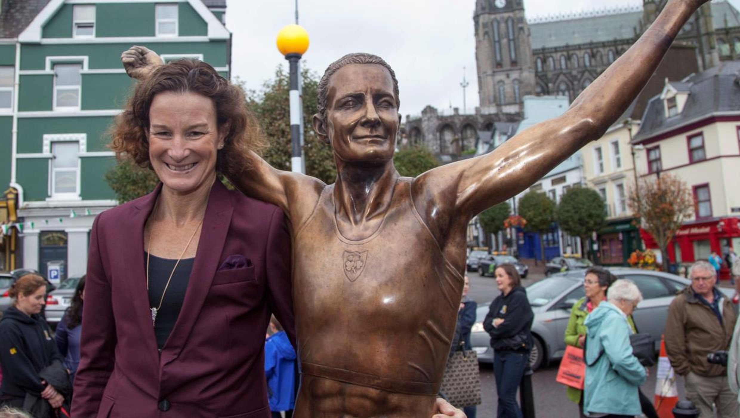 Sonia O' Sullivan with her statue in Cobh.