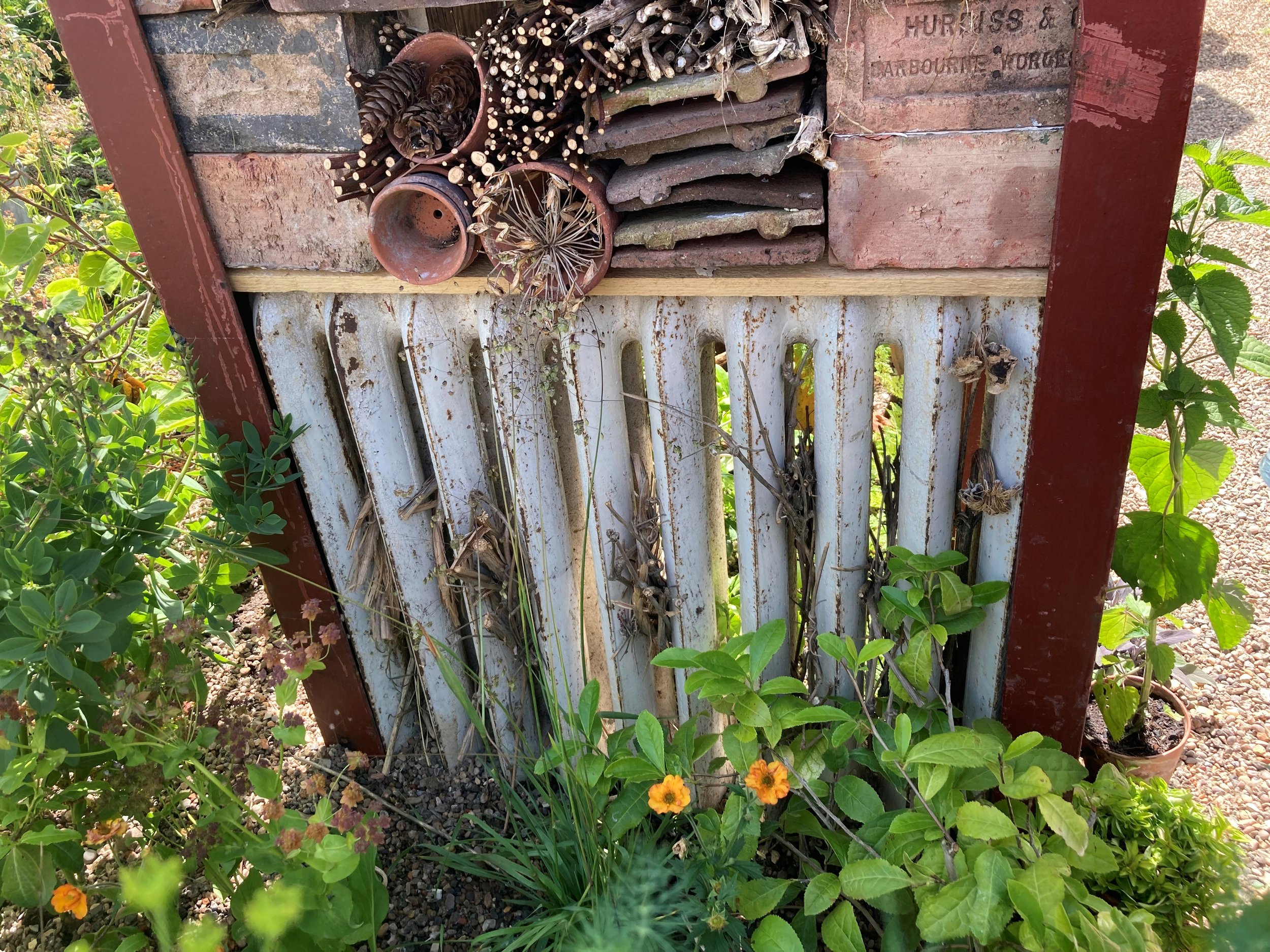 a radiator converted into a bug hotel;
