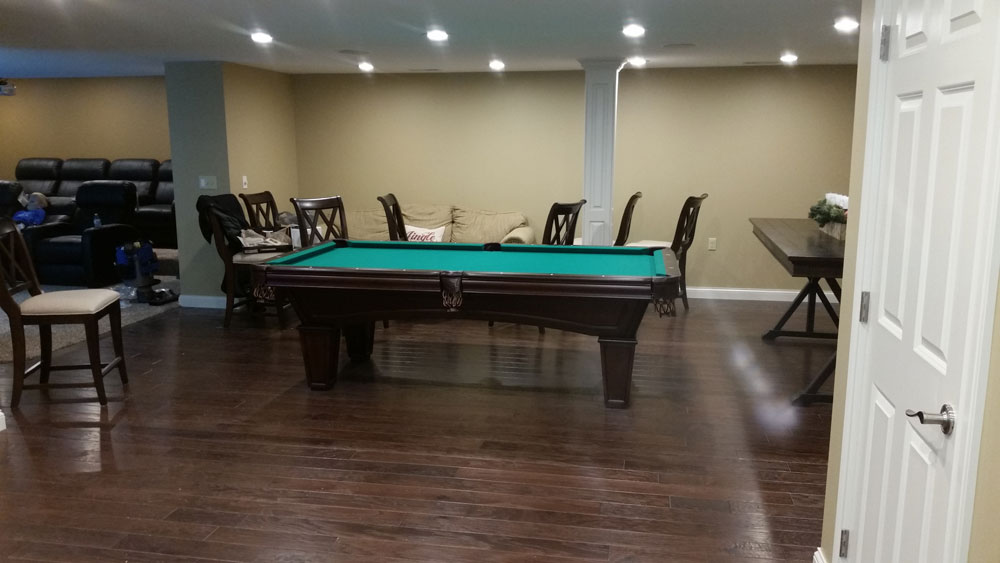 pool_table_in_living_room_luxury custom_home_builders.jpg