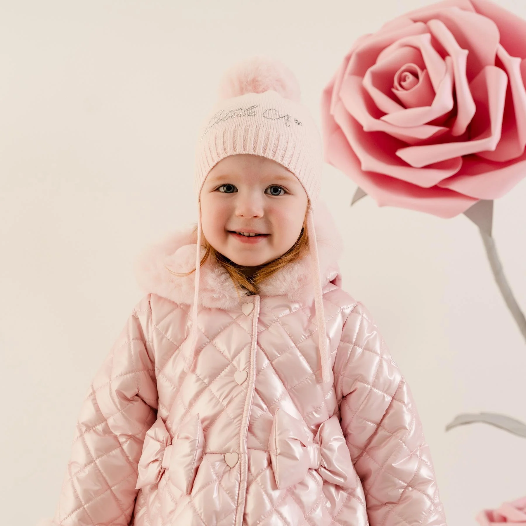 0081055_little-a-baby-little-bloom-diamond-knitted-pom-pom-hat-pale-pink.jpeg