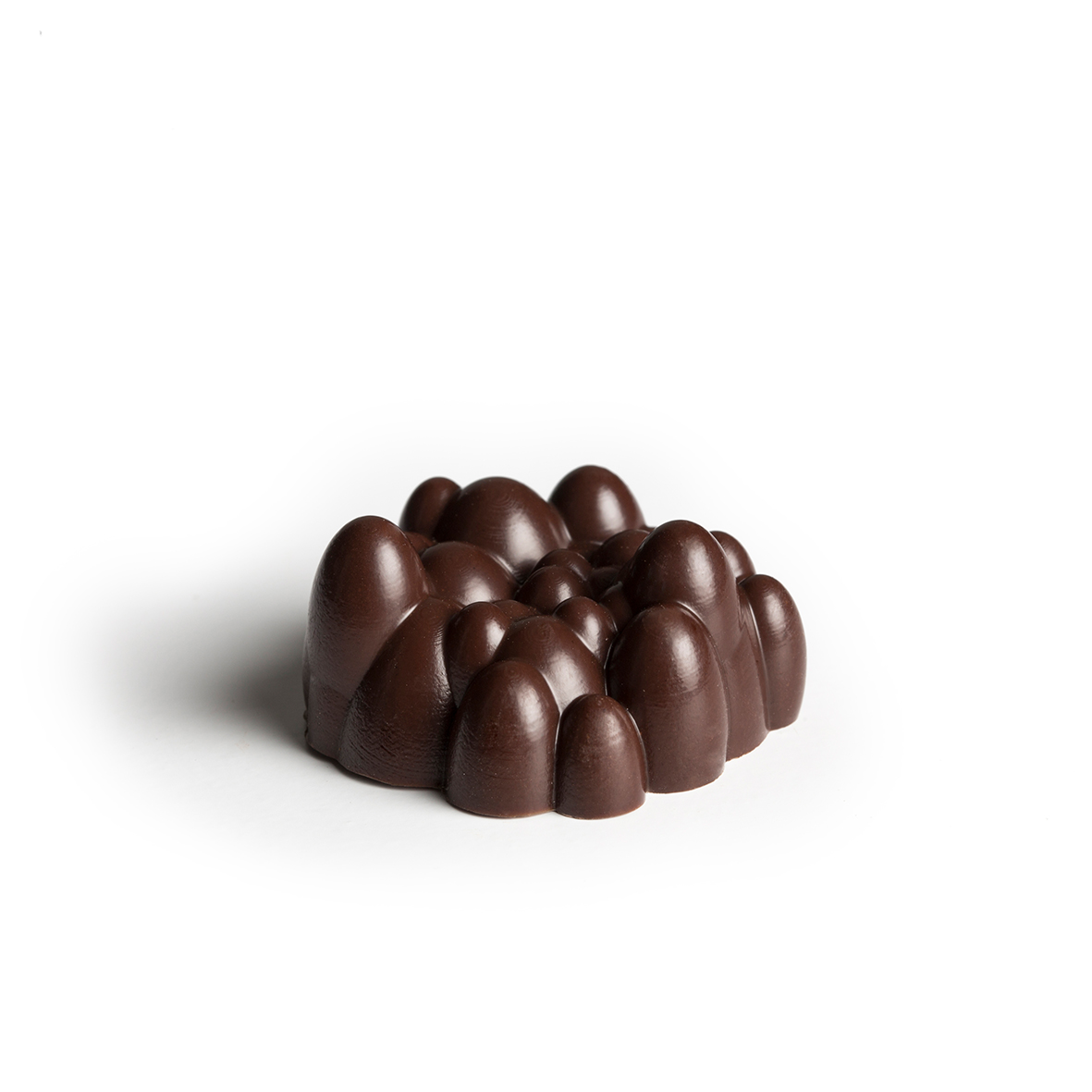 Vegemite caramel Housed in a thin chocolate shell, buttery salted caramel with a hint of Vegemite that oozes out with each bite.