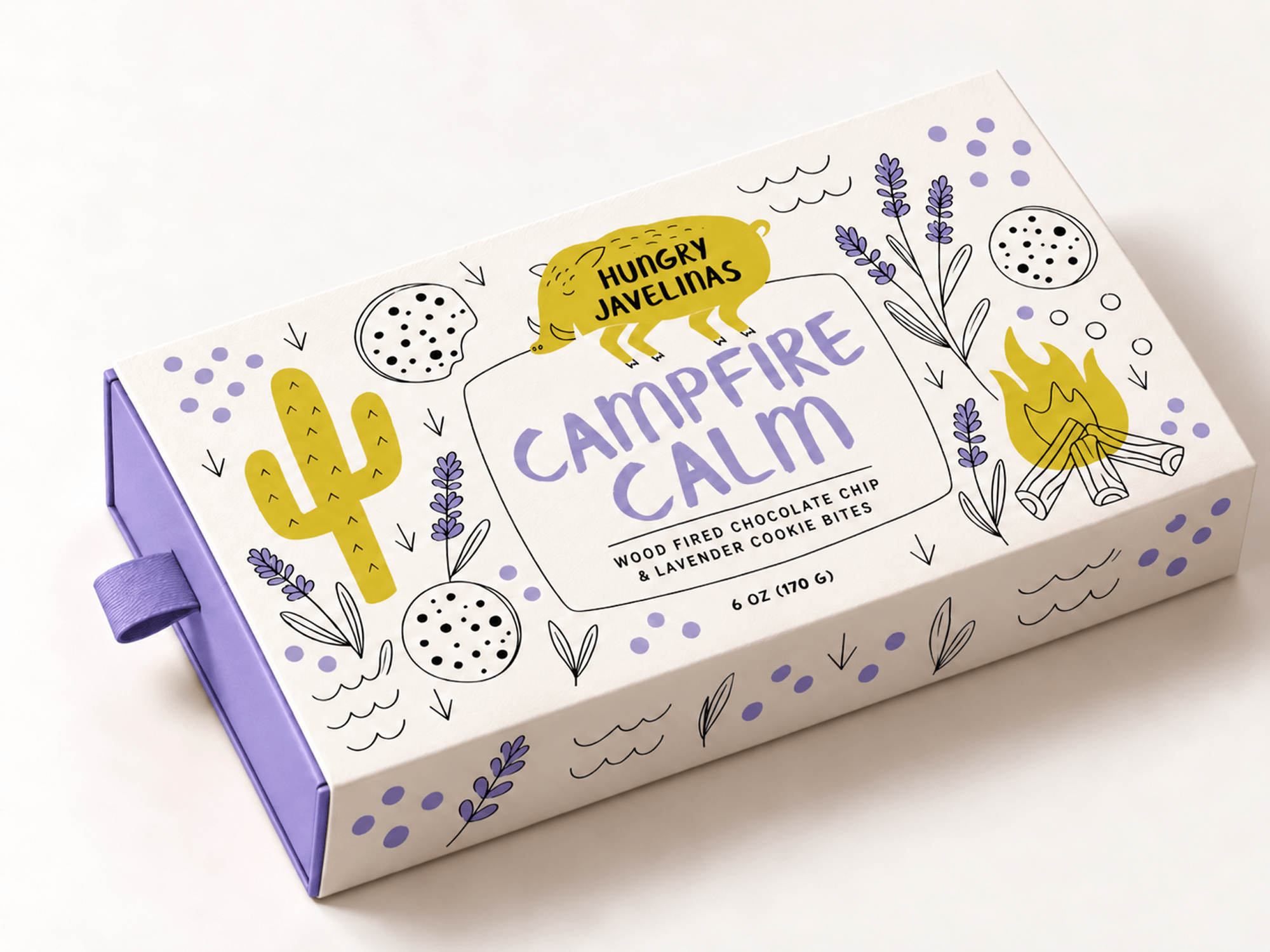 Hungry Javelinas Campfire Calm cookie bites box featuring lavender purple typography, illustrated cacti, lavender sprigs, chocolate chip cookies, and a yellow campfire.