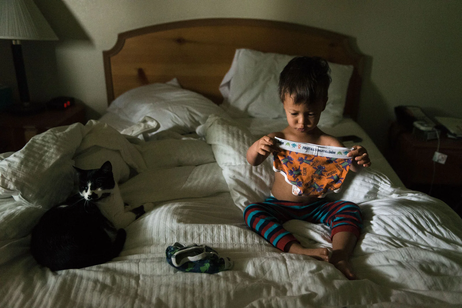 Age 2. After waking up, Harry selects his clothing for the day. He ponders underwear before moving onto pants and shirts.