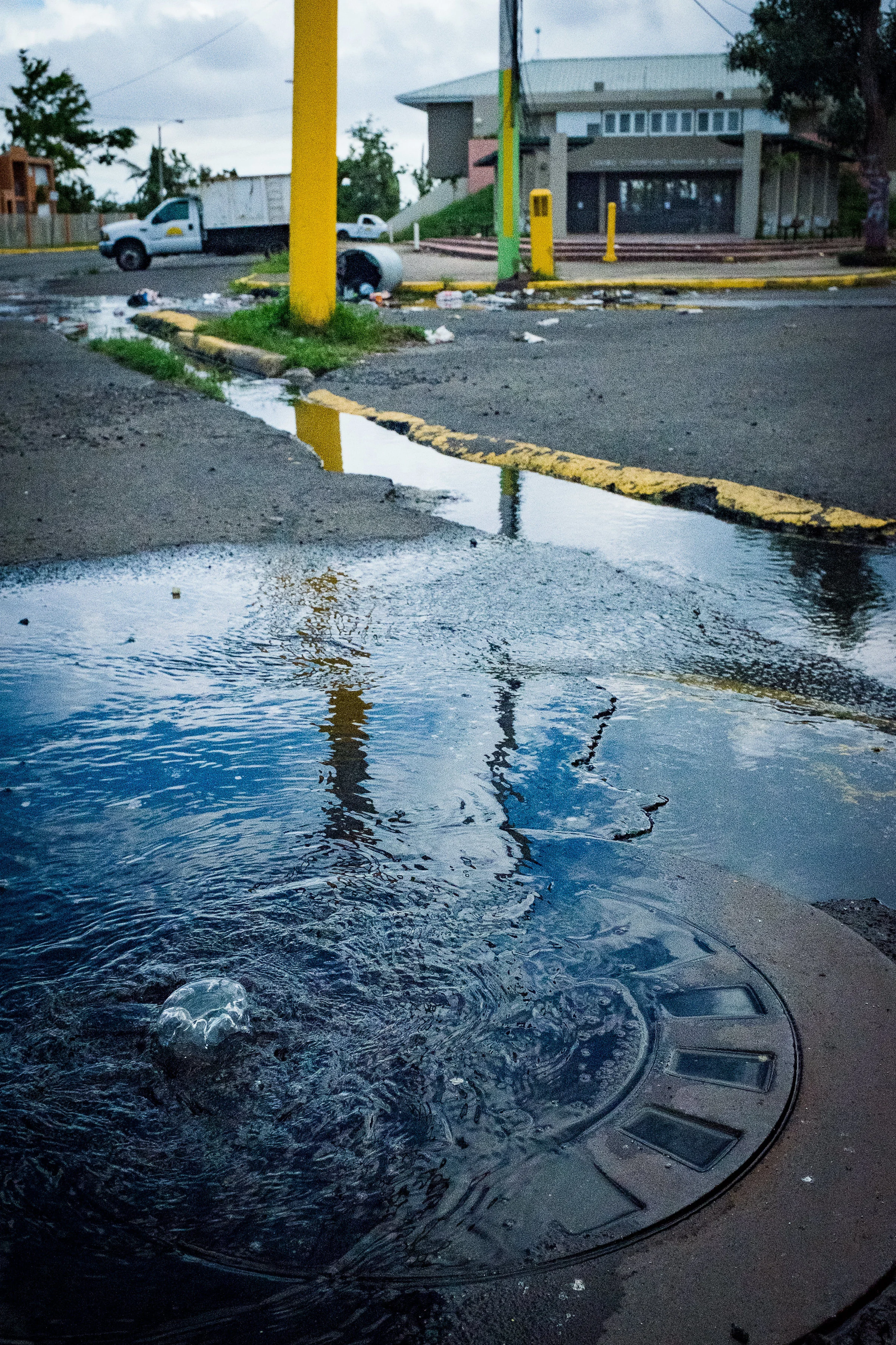 The entire neighborhood of Cantera in San Juan, PR, rests on a peninsula wrested from the Laguna Los Corozos and the Martin Peña Canal. Because the ground lies below the water table, the septic system is vacuum based, rather than gravity based. When the power goes out, the vacuums go out, and sewage back flows into the streets. Photo: Katie Jett Walls
