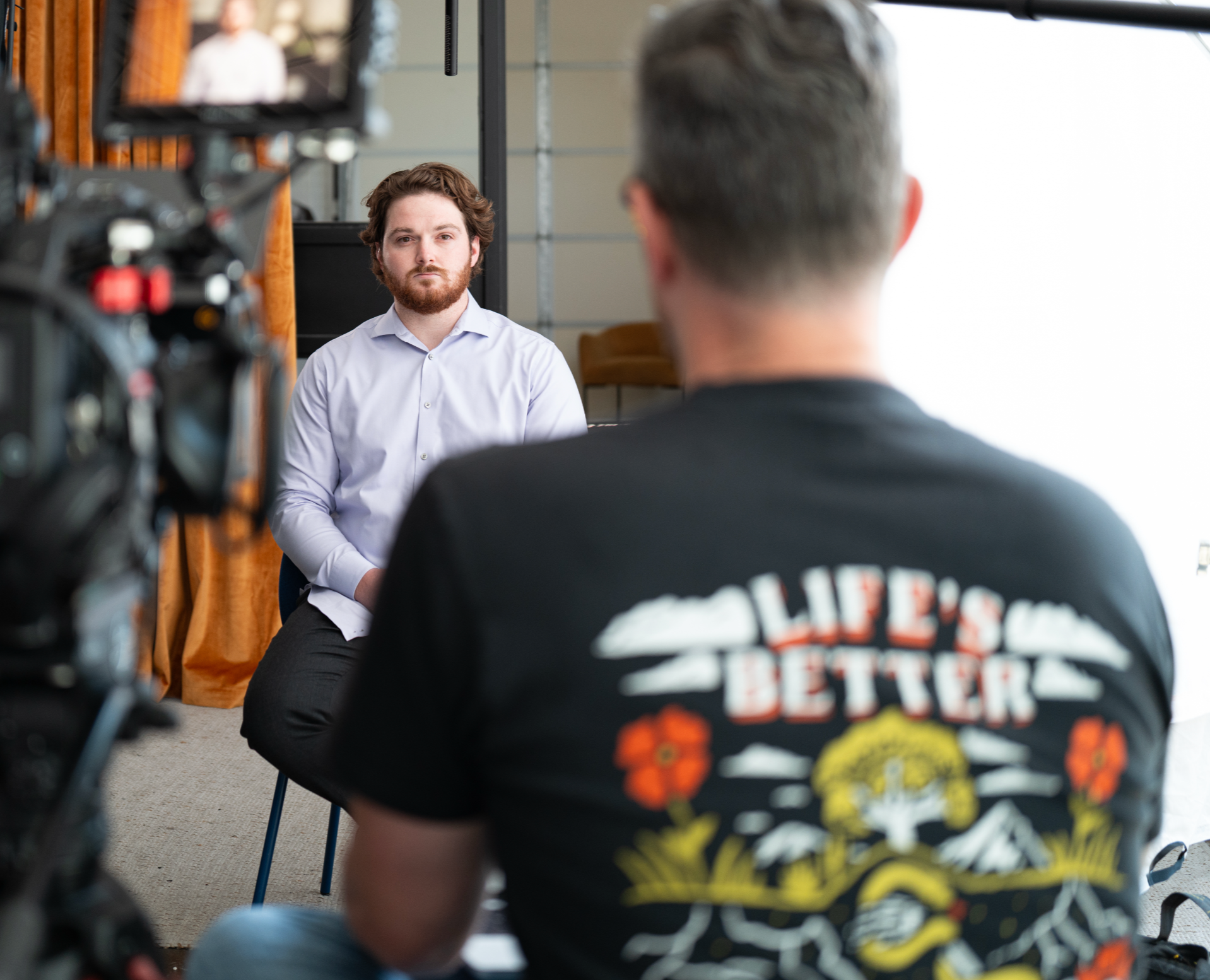 Dustin Vyers interviewing and directing a video shoot for a client