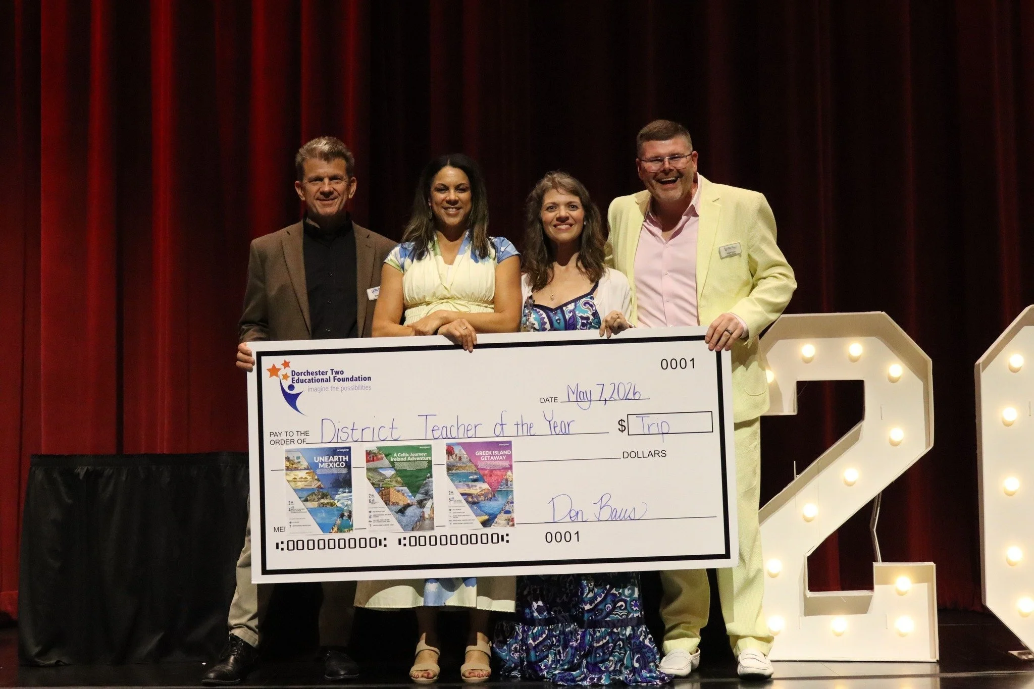 Dorchester Two Educational Foundation Presents Teacher of the Year with Trip
