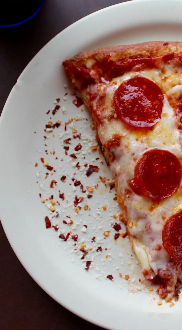 Canva+-+Sliced+Pepperoni+Pizza+on+White+Ceramic+Plate.jpg