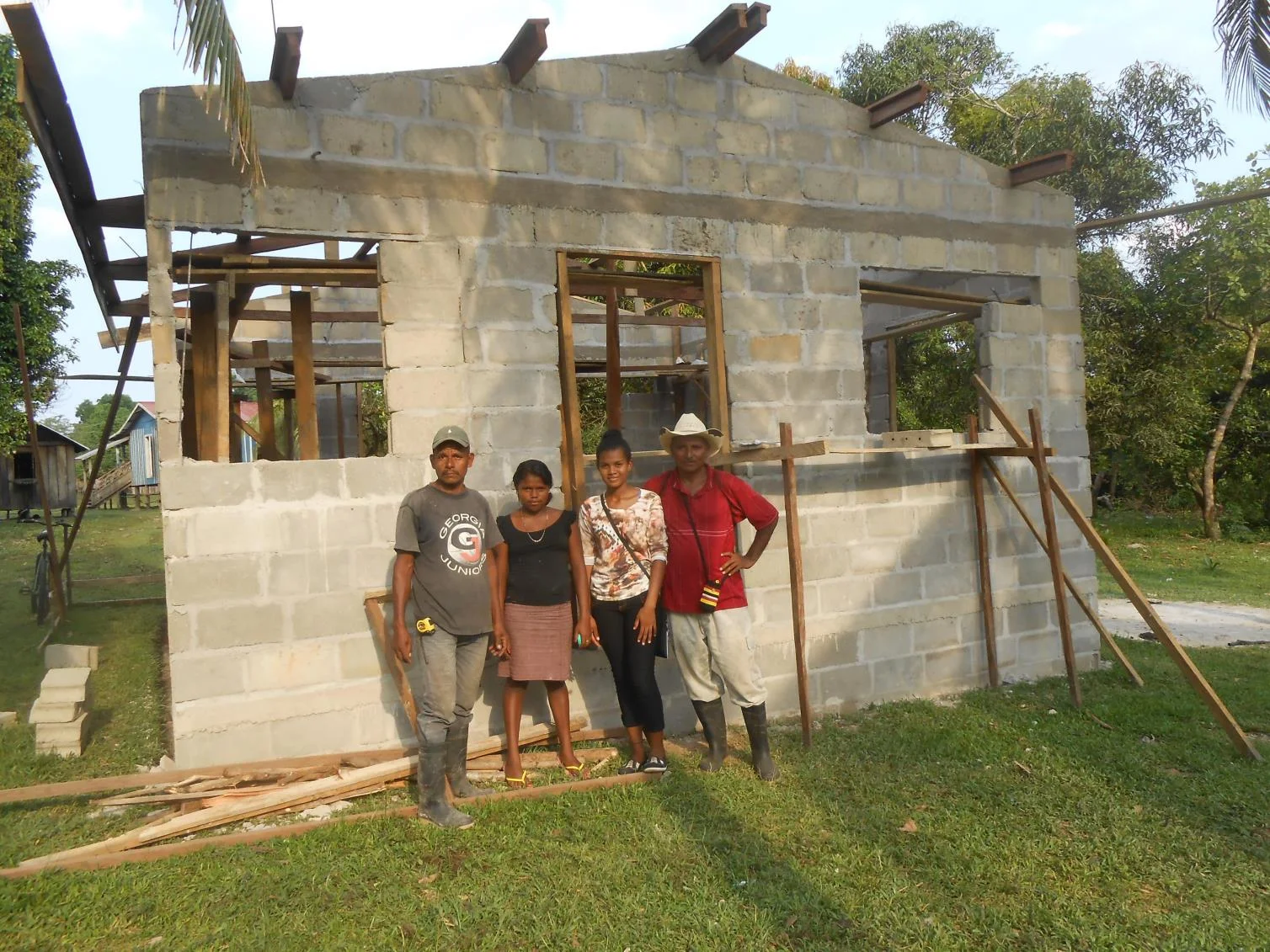 family in front of habitat house.jpg