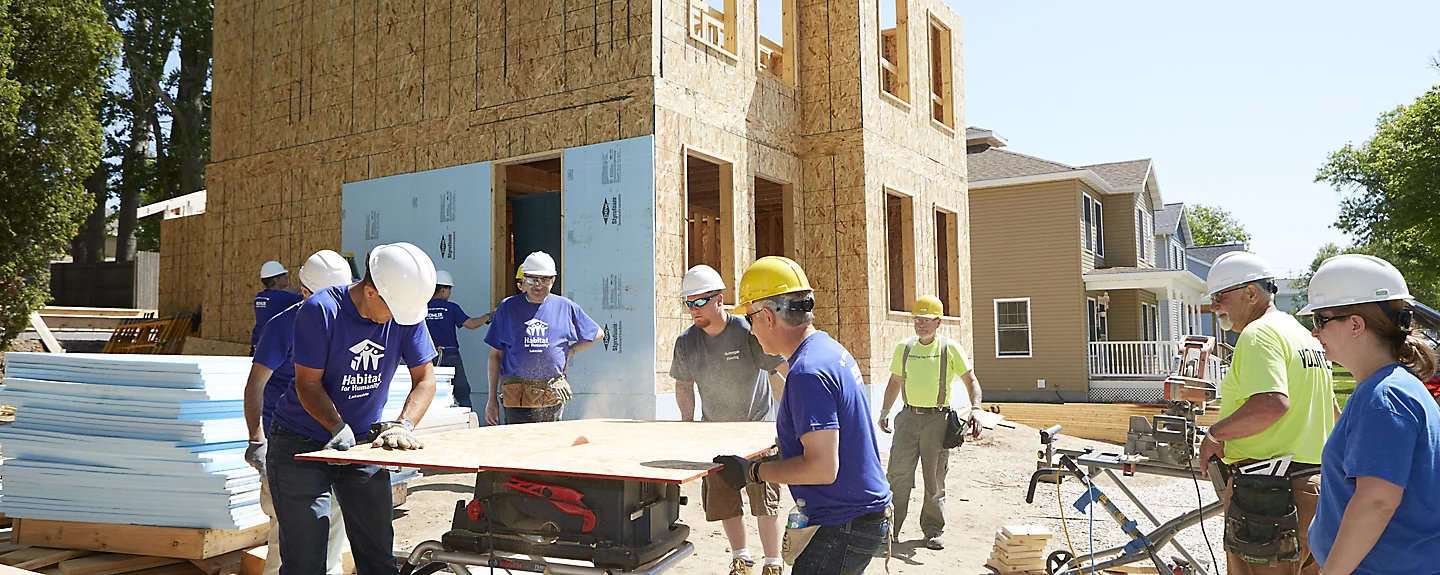 A group of volunteers from Kohler volunteer with HFH Lakeside to construct a new home.