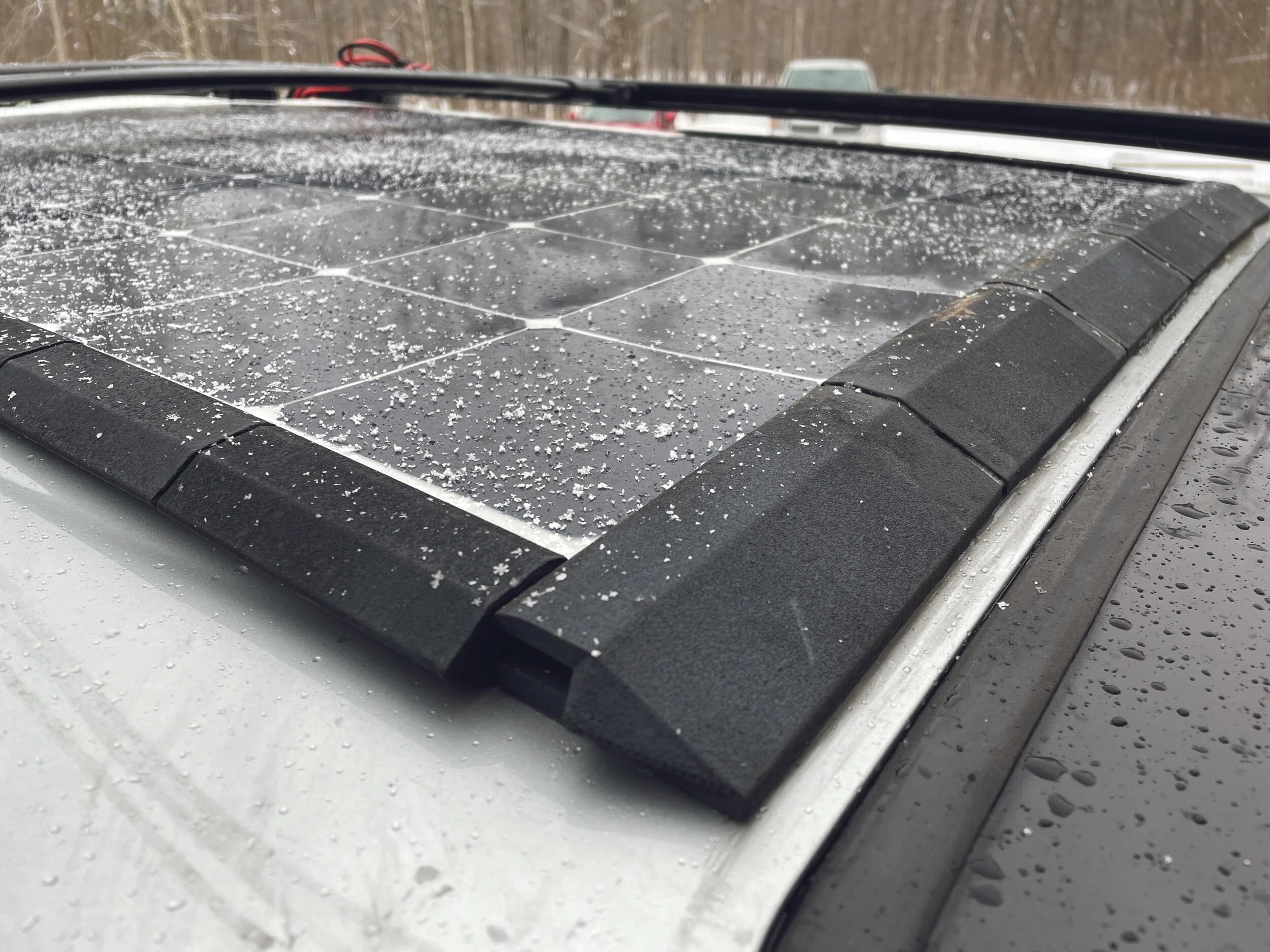 All weather, aerodynamic RV flexible solar panel mounts