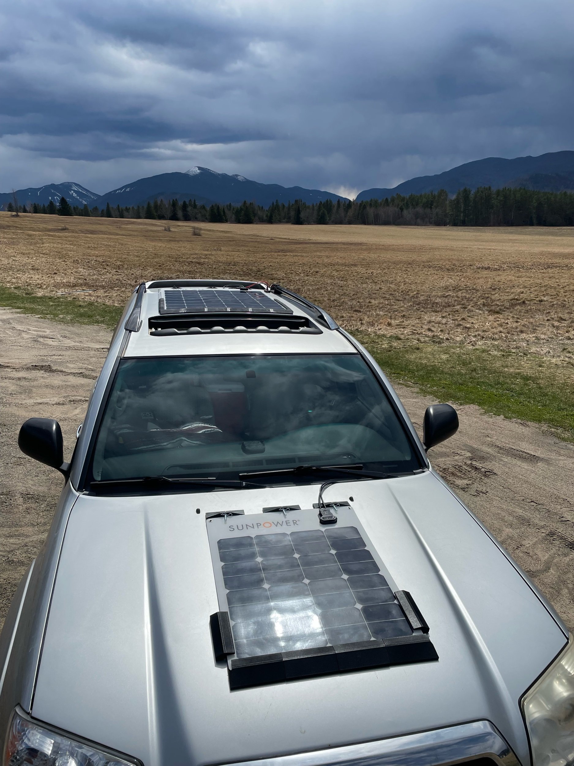 Car hood solar panel mounts