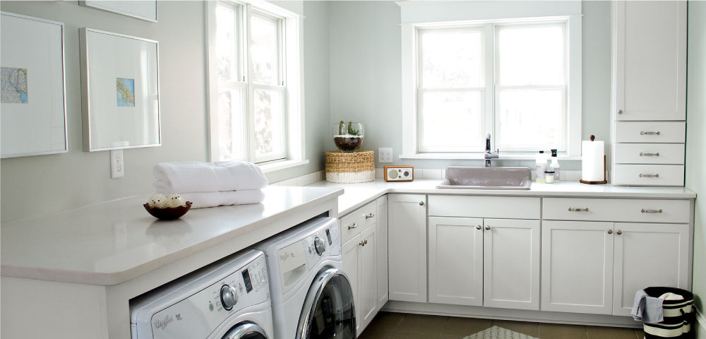 white flat panel laundry room cabinets