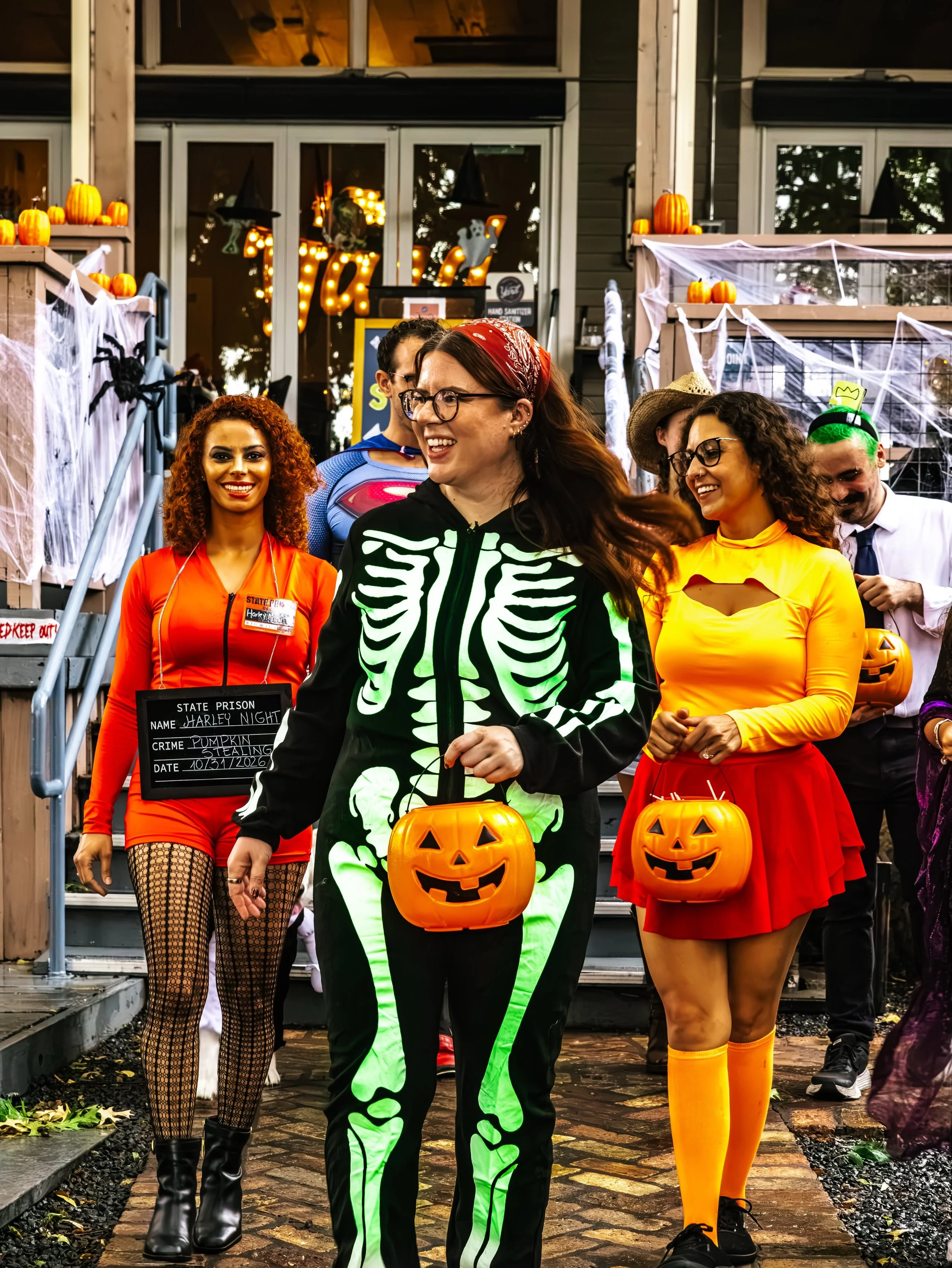 The whole place is in costume. You should be too.
Pumpkins on the railings, candy corn on the drinks, friends clinking cups under the cobwebs. Halloween at The Yard, Downtown McKinney, through the 31st.