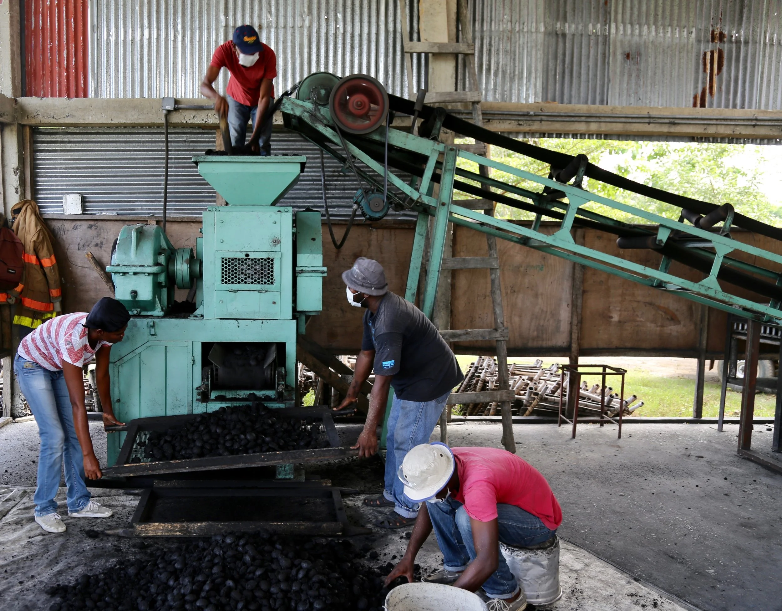 Men processing charcoal.jpg