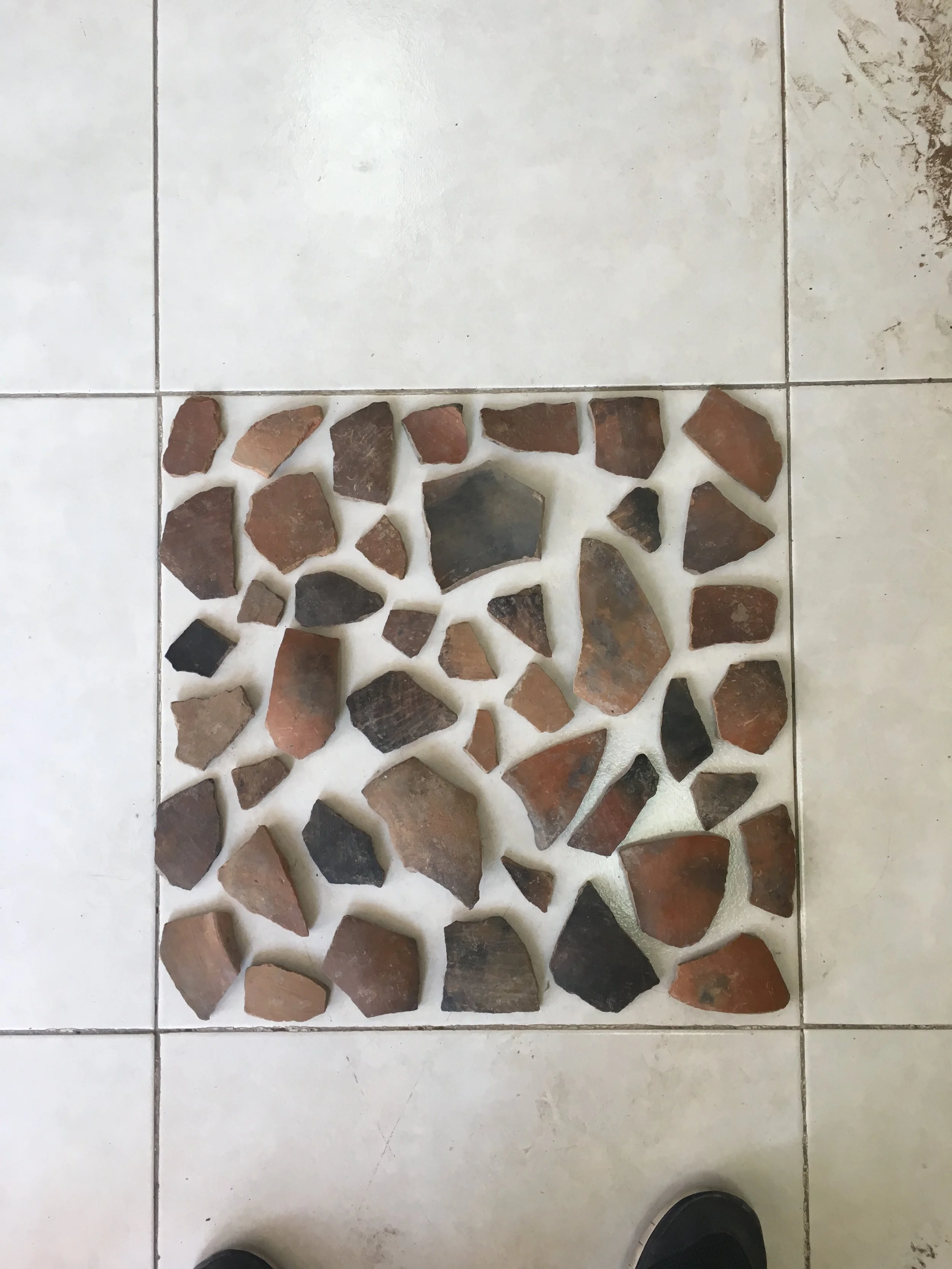 Before actually constructing the replica altar, we laid out the ceramic fragments. Luckily, at 50cm x 50cm the linoleum floor squares were almost exactly the same size as the altar.