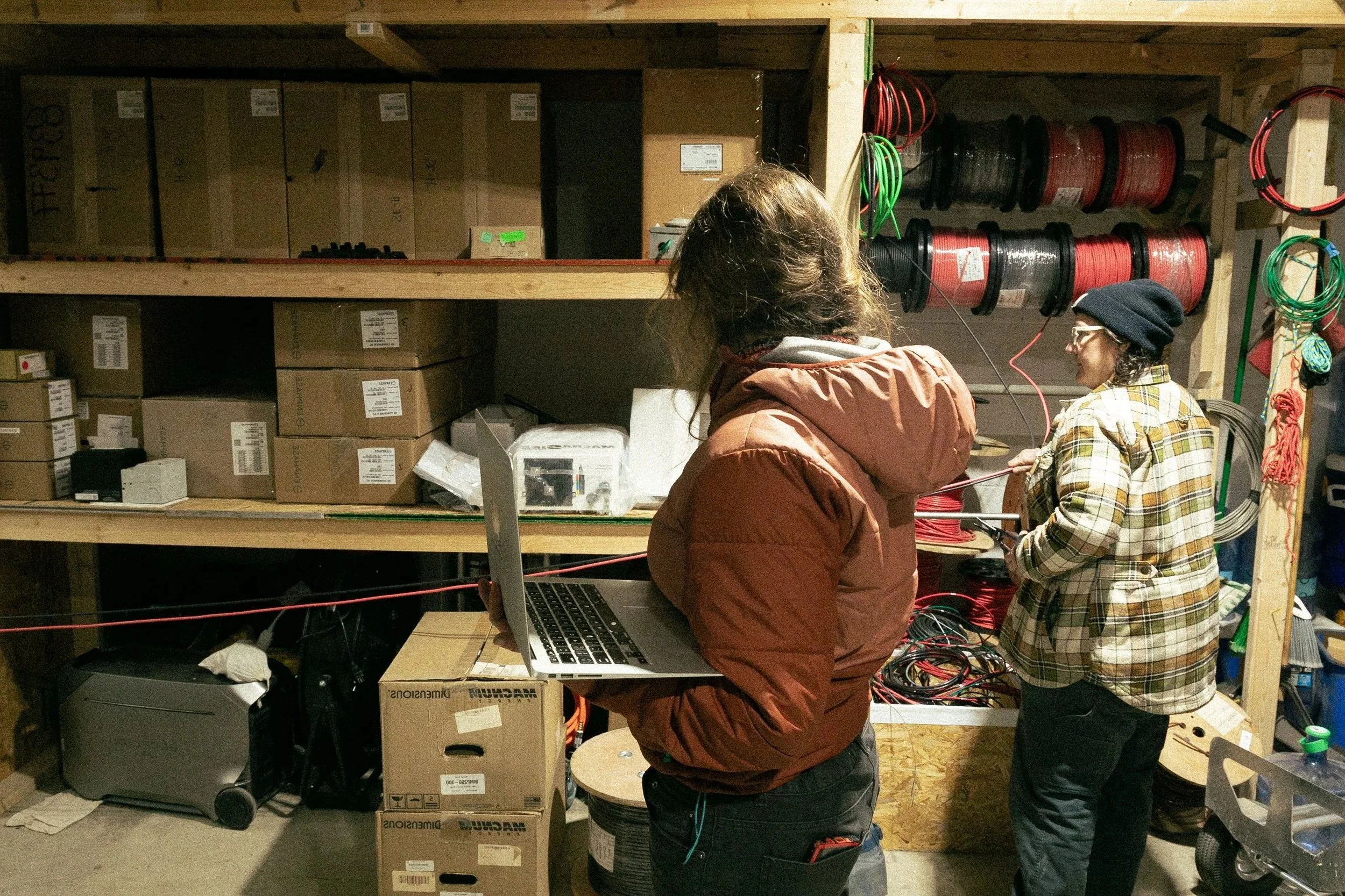 Two people collaborate with equipment