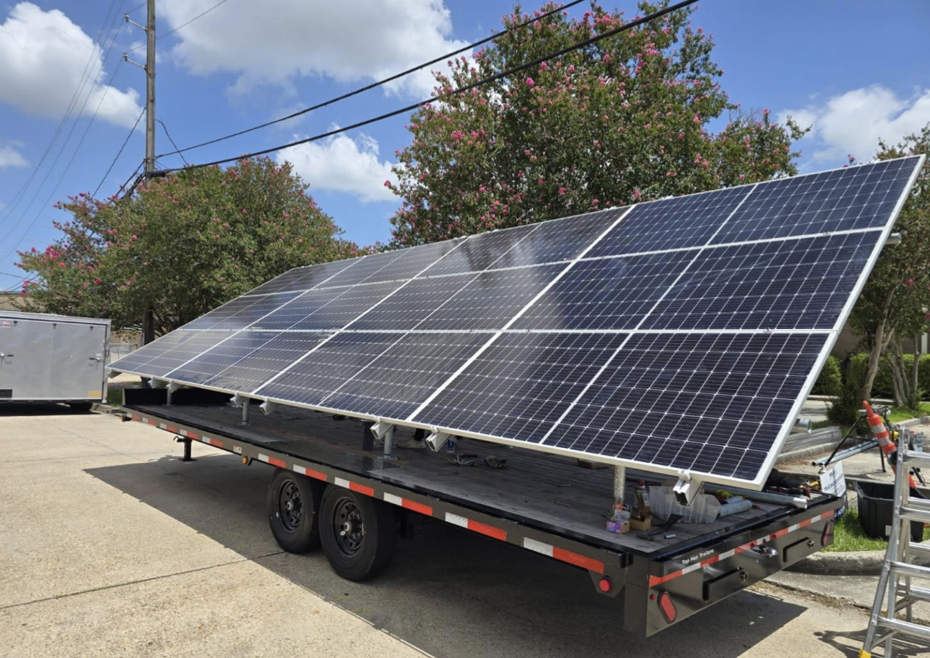 Image of solar panels on a trailer that links to a case study on the first Beehive.
