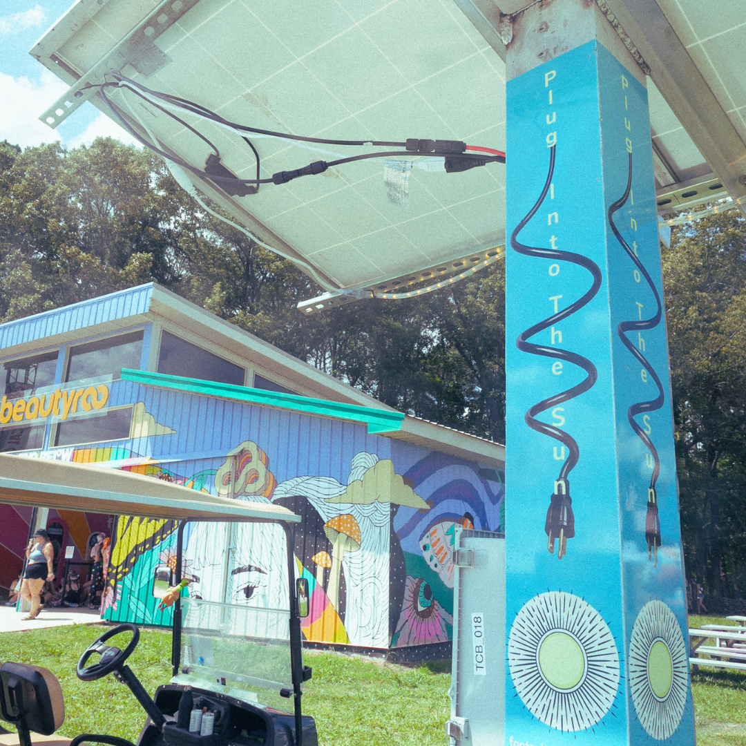 A portable solar-powered charging station is setup at Bonaroo for attendees to charge their devices without electricity.