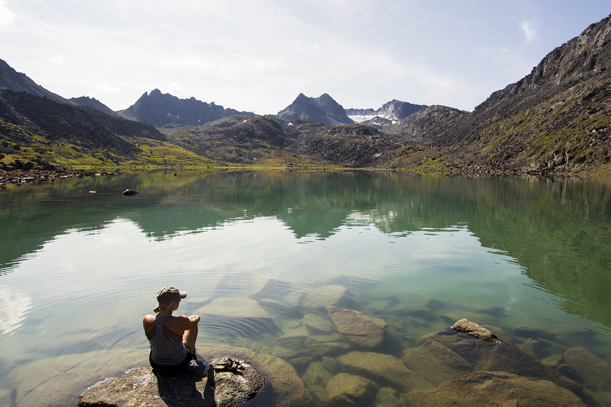 woman looking over lake in talkeetna mountains