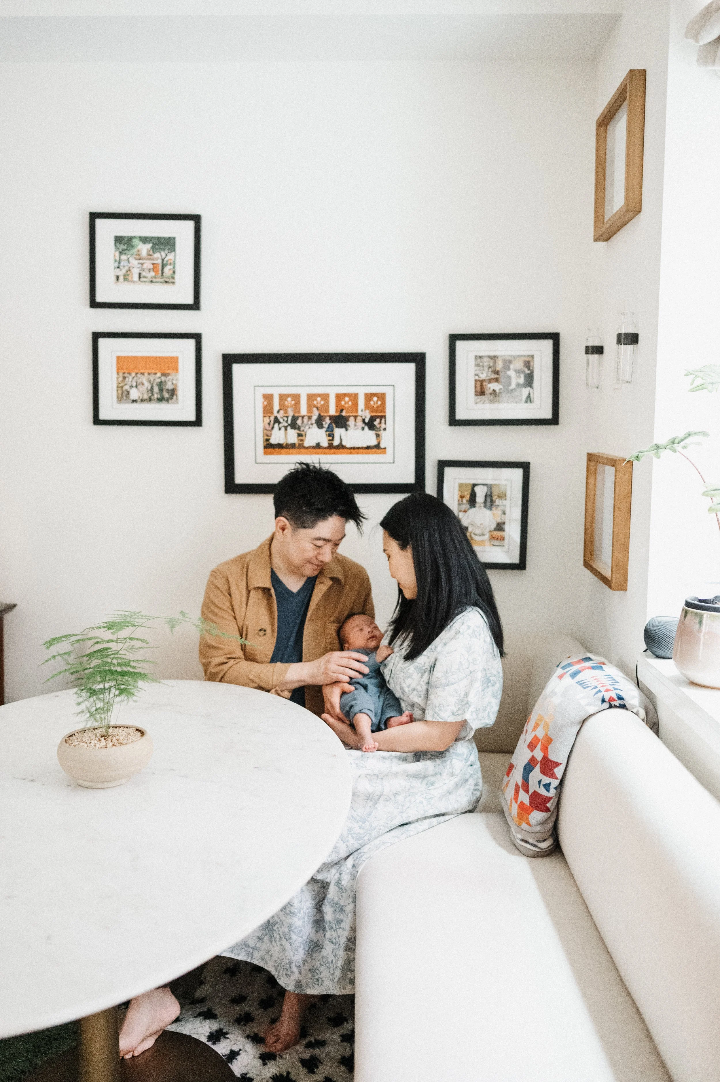 Mom, Dad and baby sitting in dining room