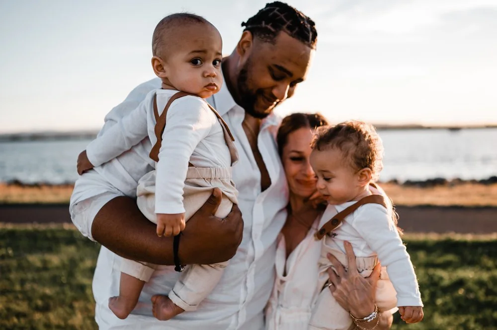 family of four at sunset