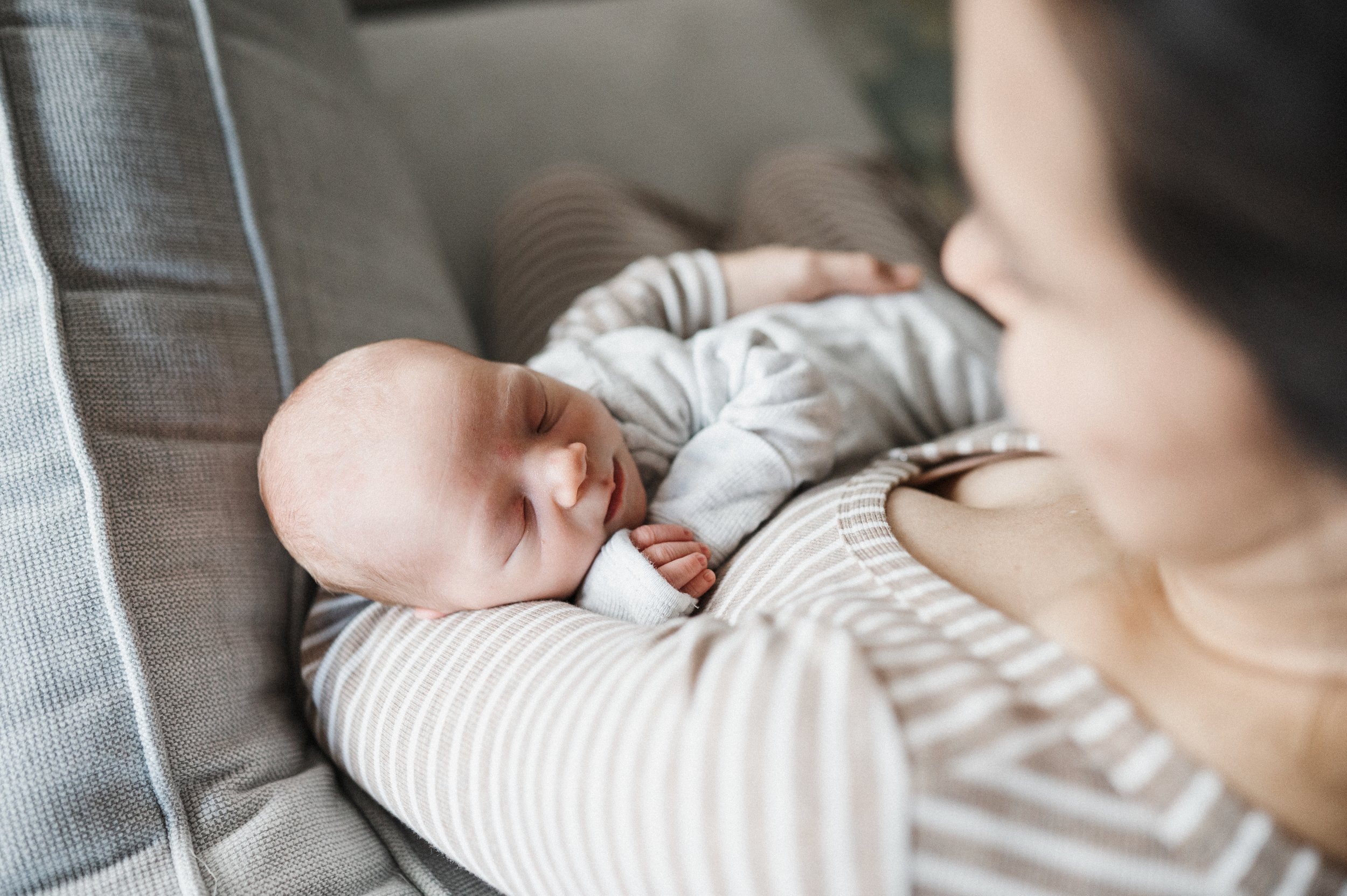 sleeping baby in mom's arms