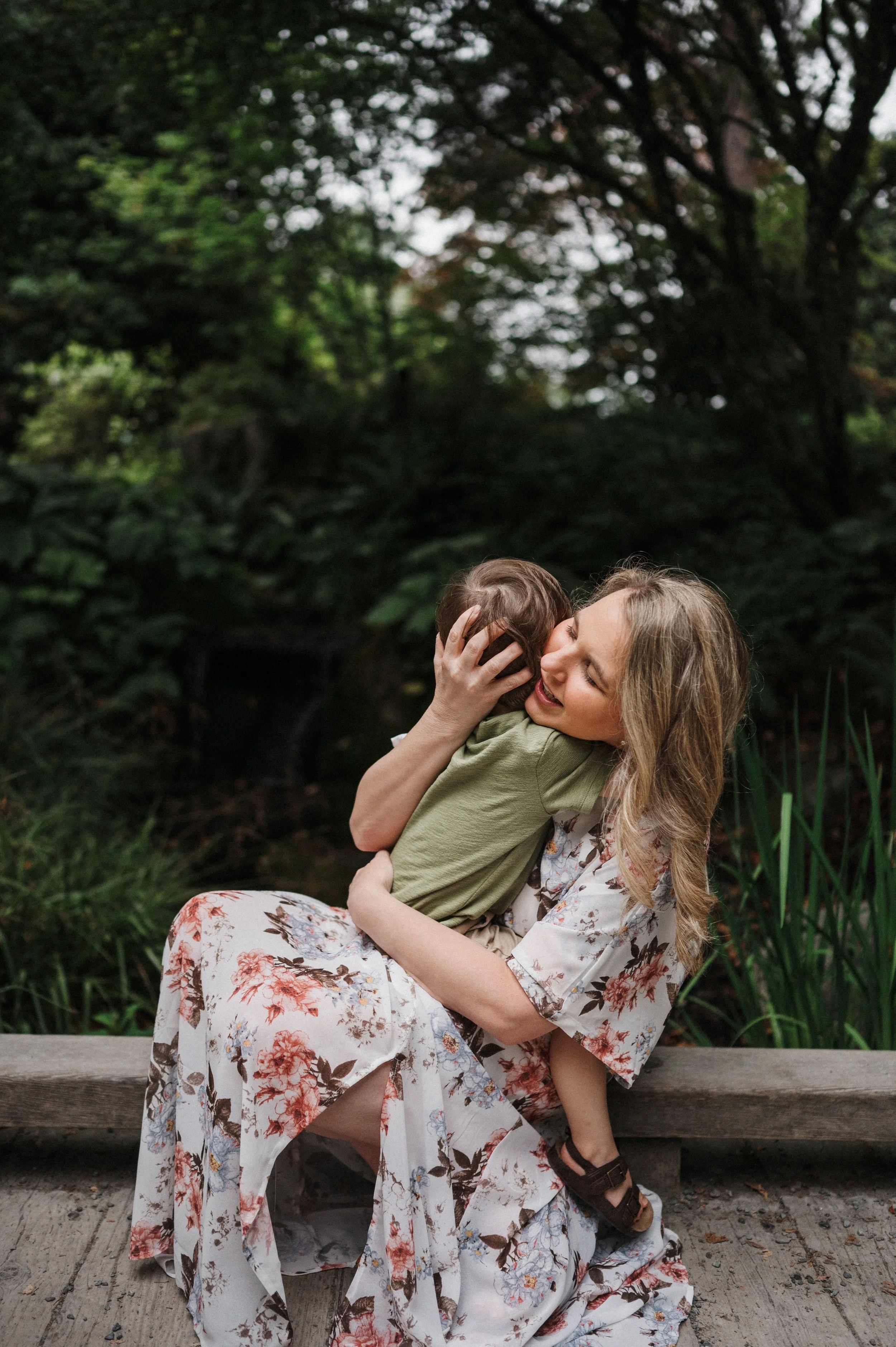 Mom hugging child during lifestyle photography session