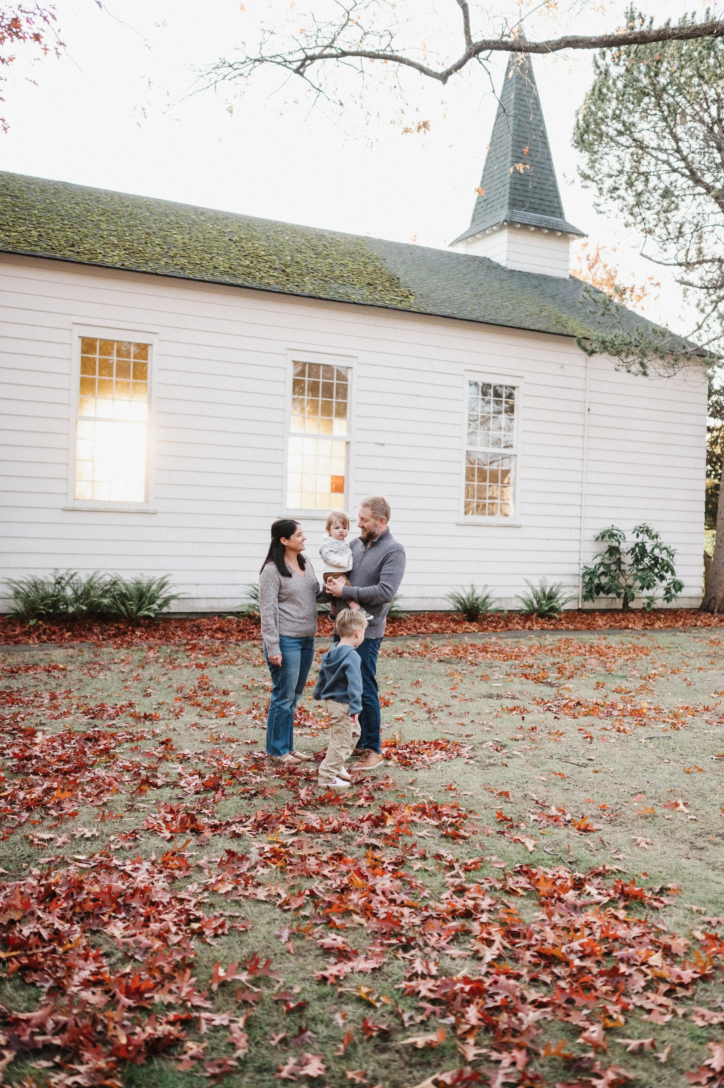 family of four snuggling together at Discovery Park