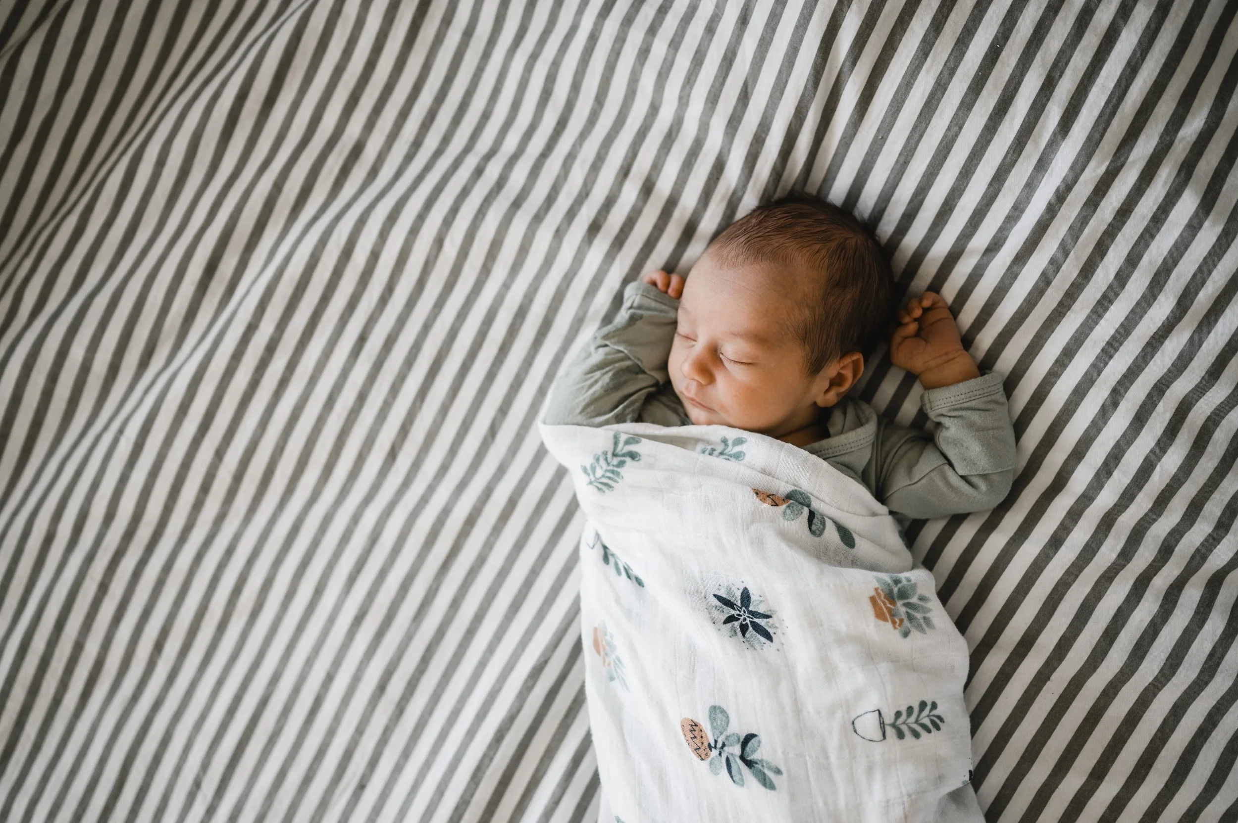 baby asleep on bed