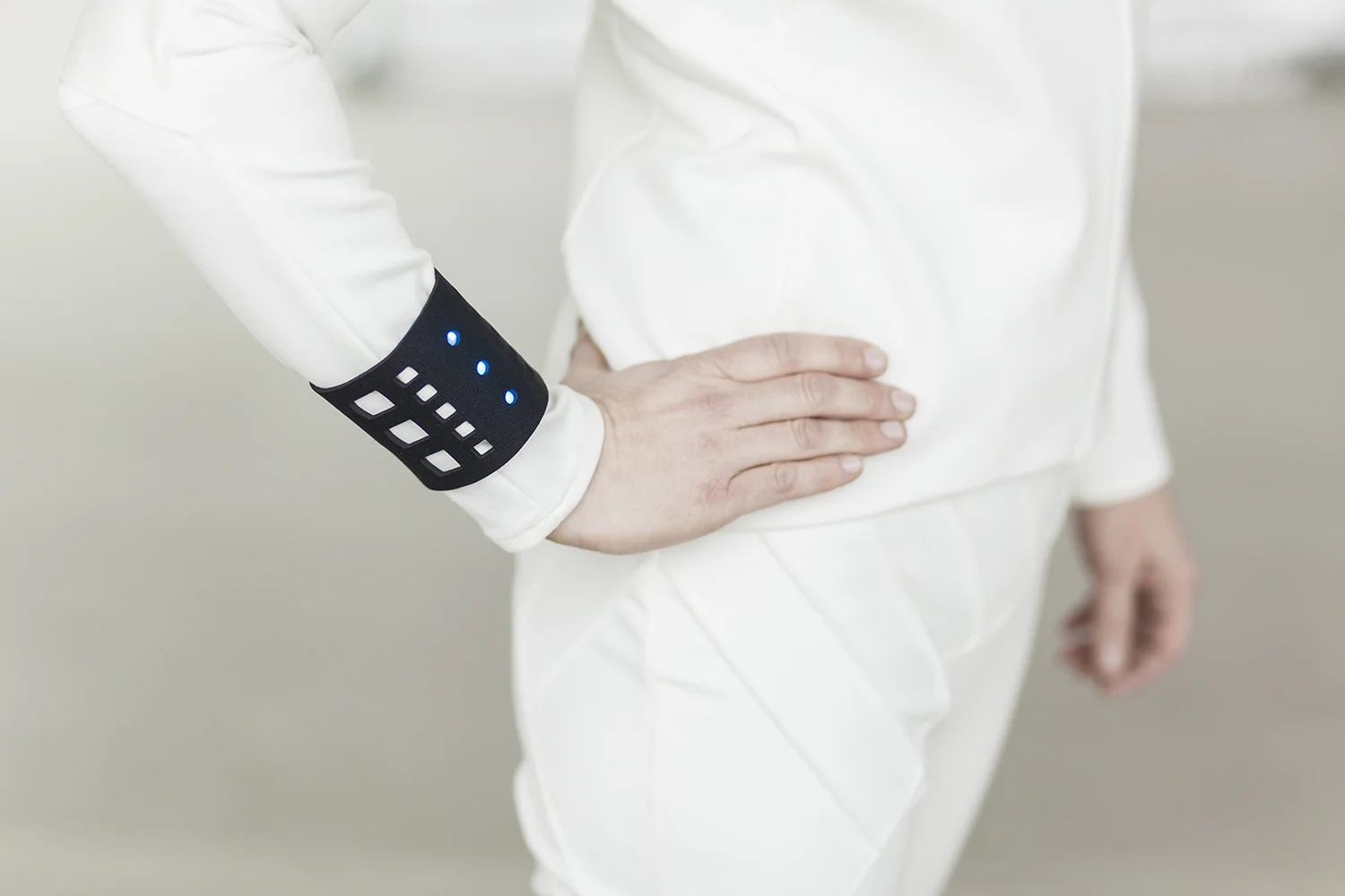 Pictured here is a wristband with blue lights integrated to represent the concept of housing electronics of various sorts into cushioned neoprene (a camera, heart monitor...etc.)