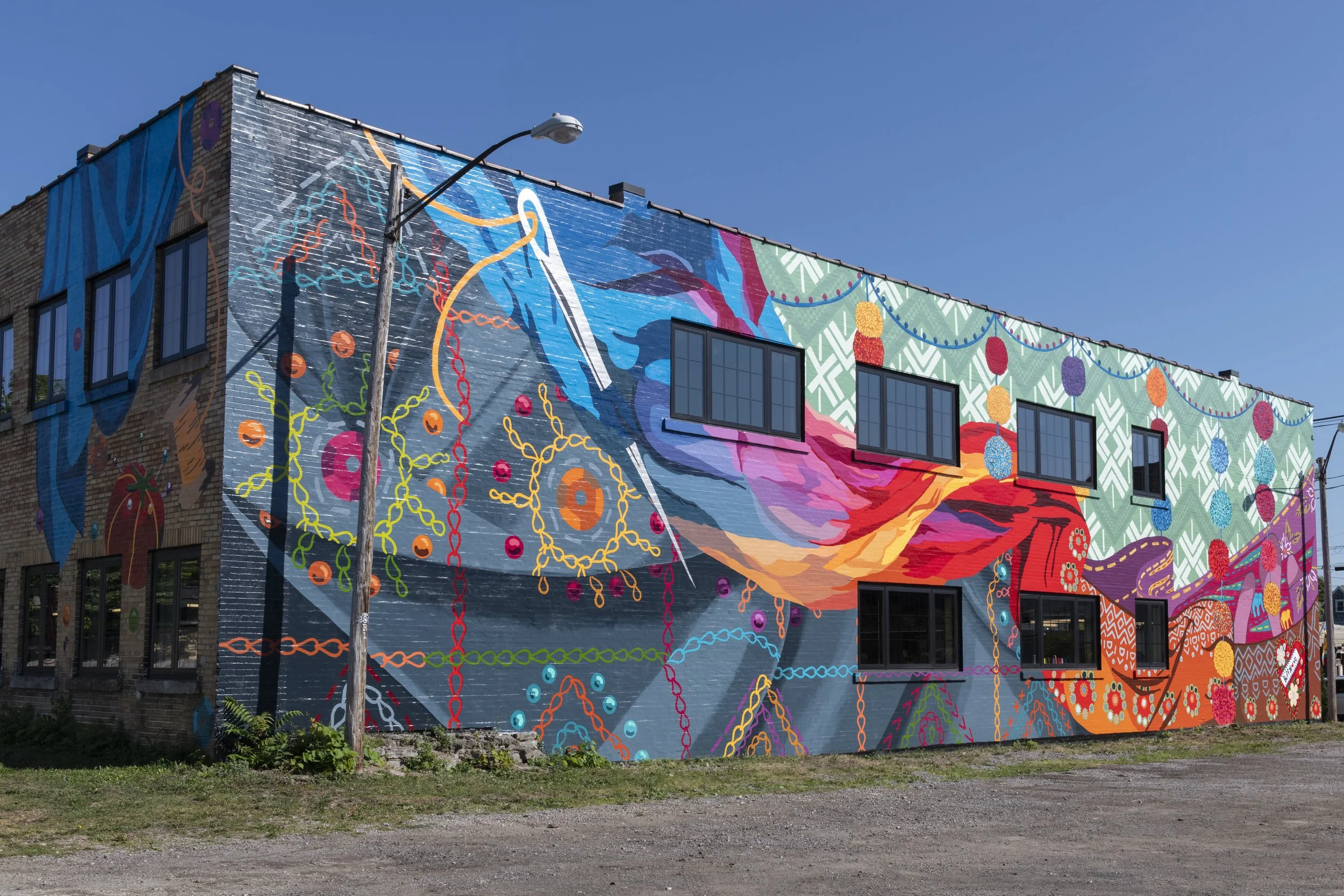  Image of Stitch Buffalo mural,  Community Cloth: Stories in Thread,  by Saira Siddiqui as part of AKG Art Museum’s Public Art Initiative, 2025. ( Download 11.5MB File ) 