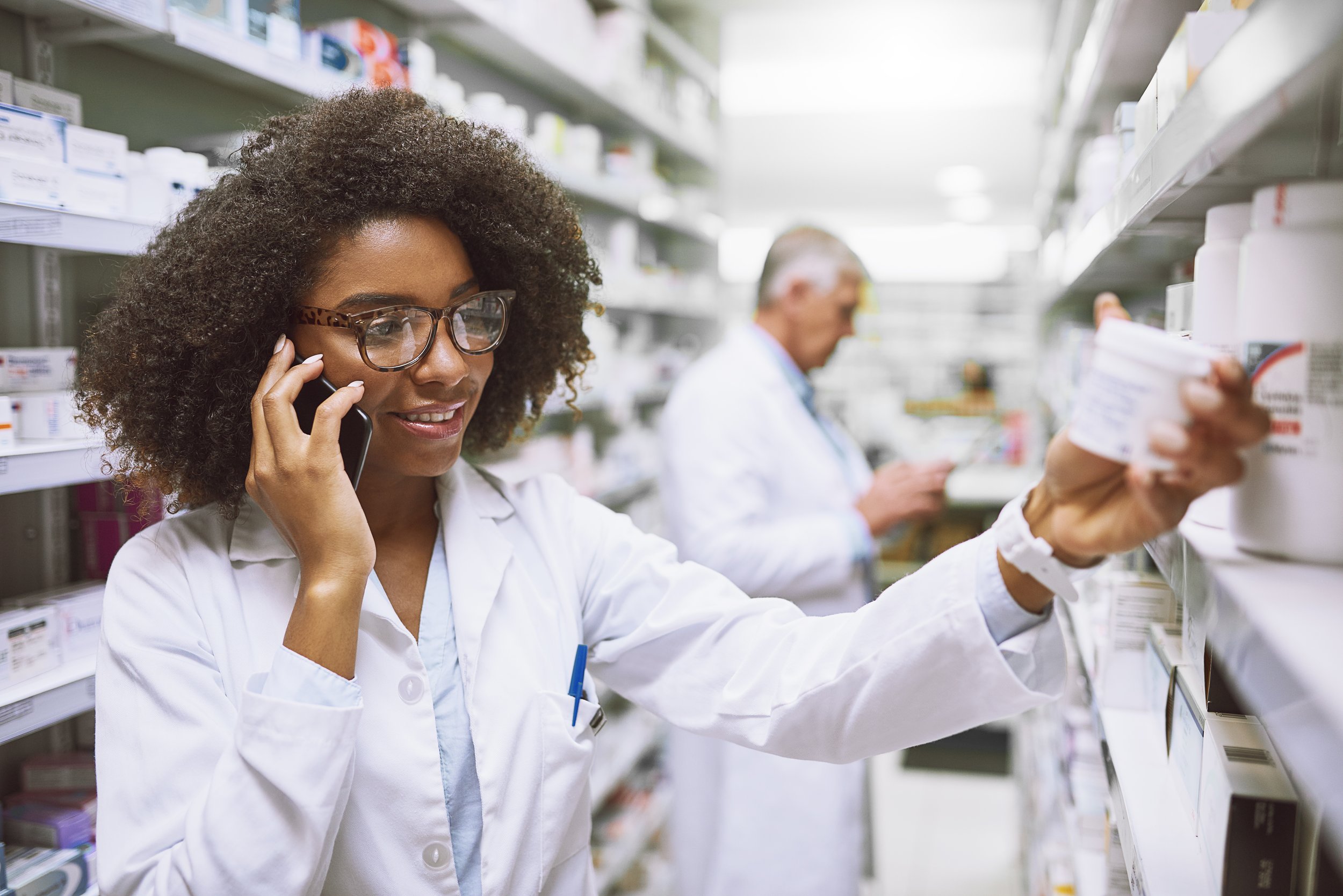 Pharmacist on mobile phone