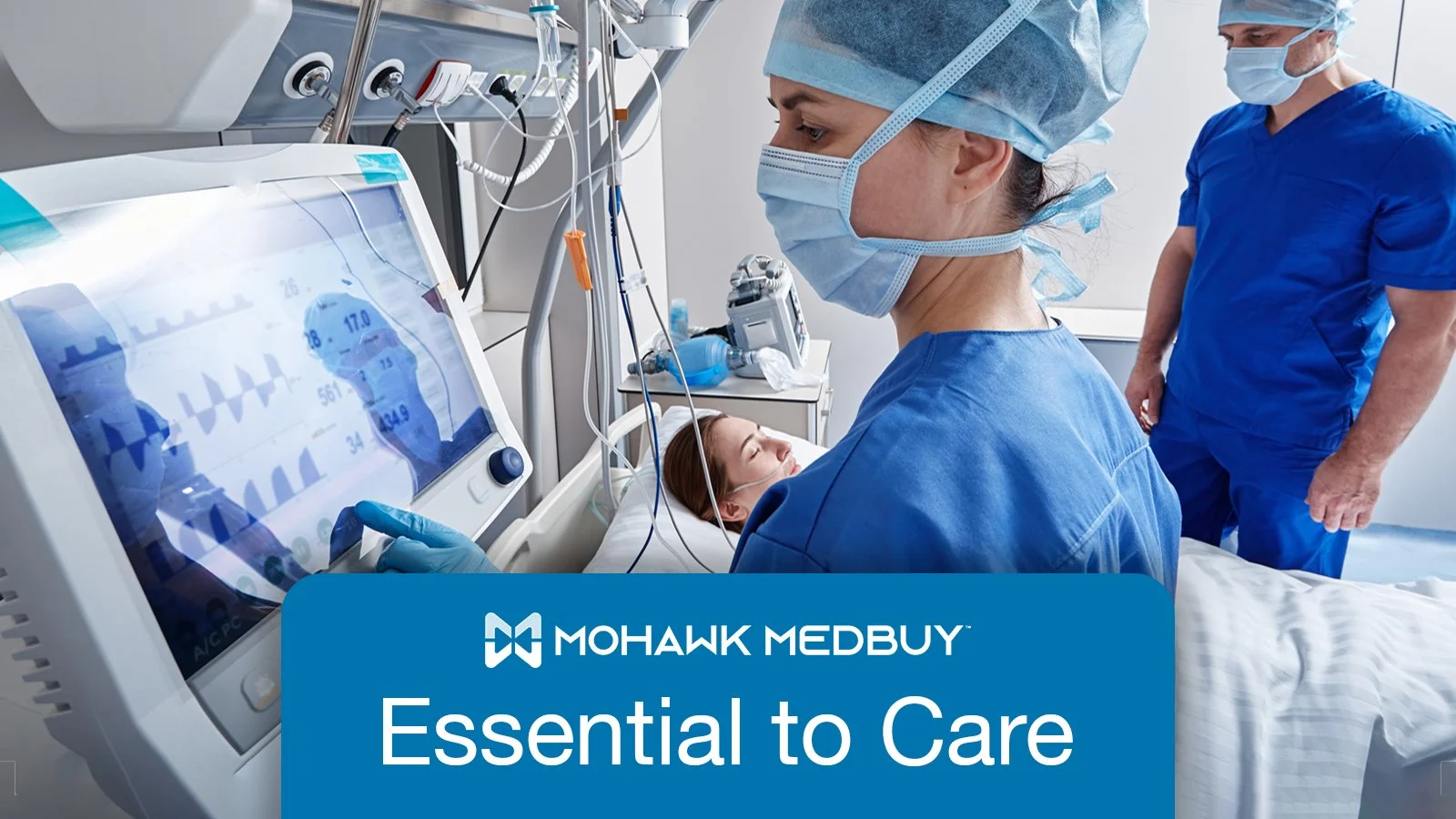 Two nurses at patient bedside and one is reviewing the heart monitor with the MMC logo and headline that reads "Essential to Care"