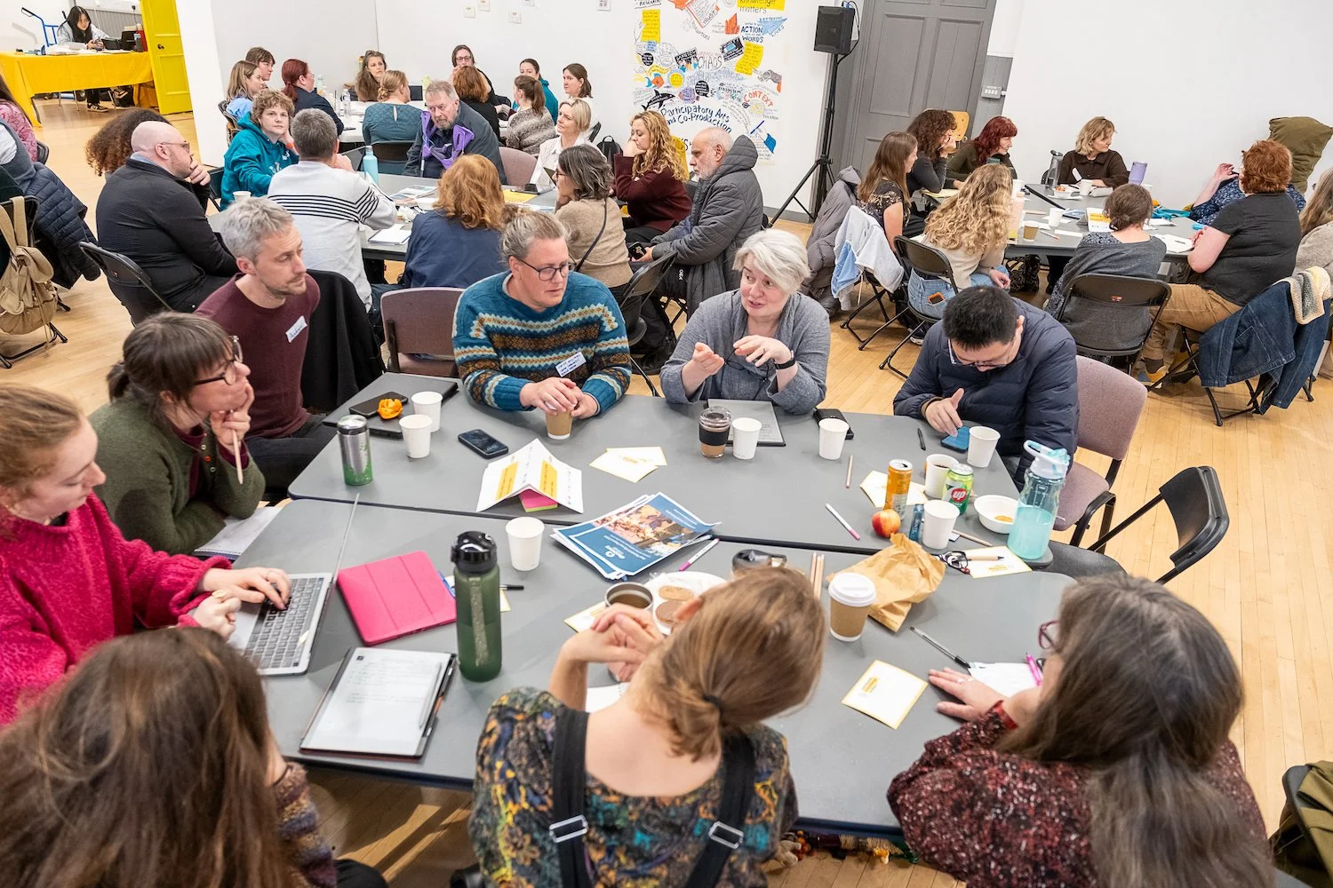 Community Knowledge Matters Gathering - November 2025 - Discussion Table - People discussing - Image Credit Alexander Williamson www.alexander-williamson.com139.jpg