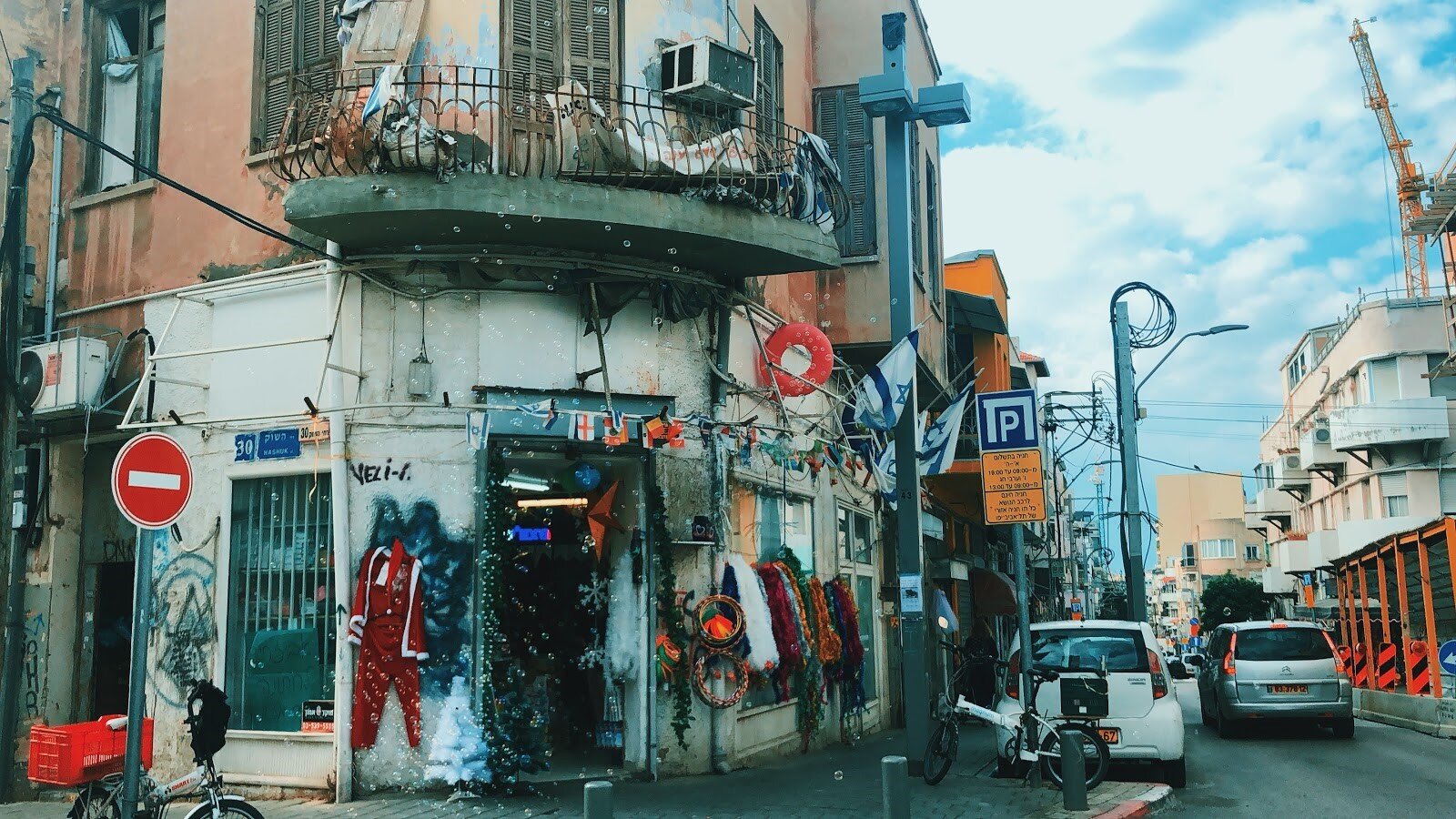  A corner in Tel Aviv covered with Israeli flags and graffiti 