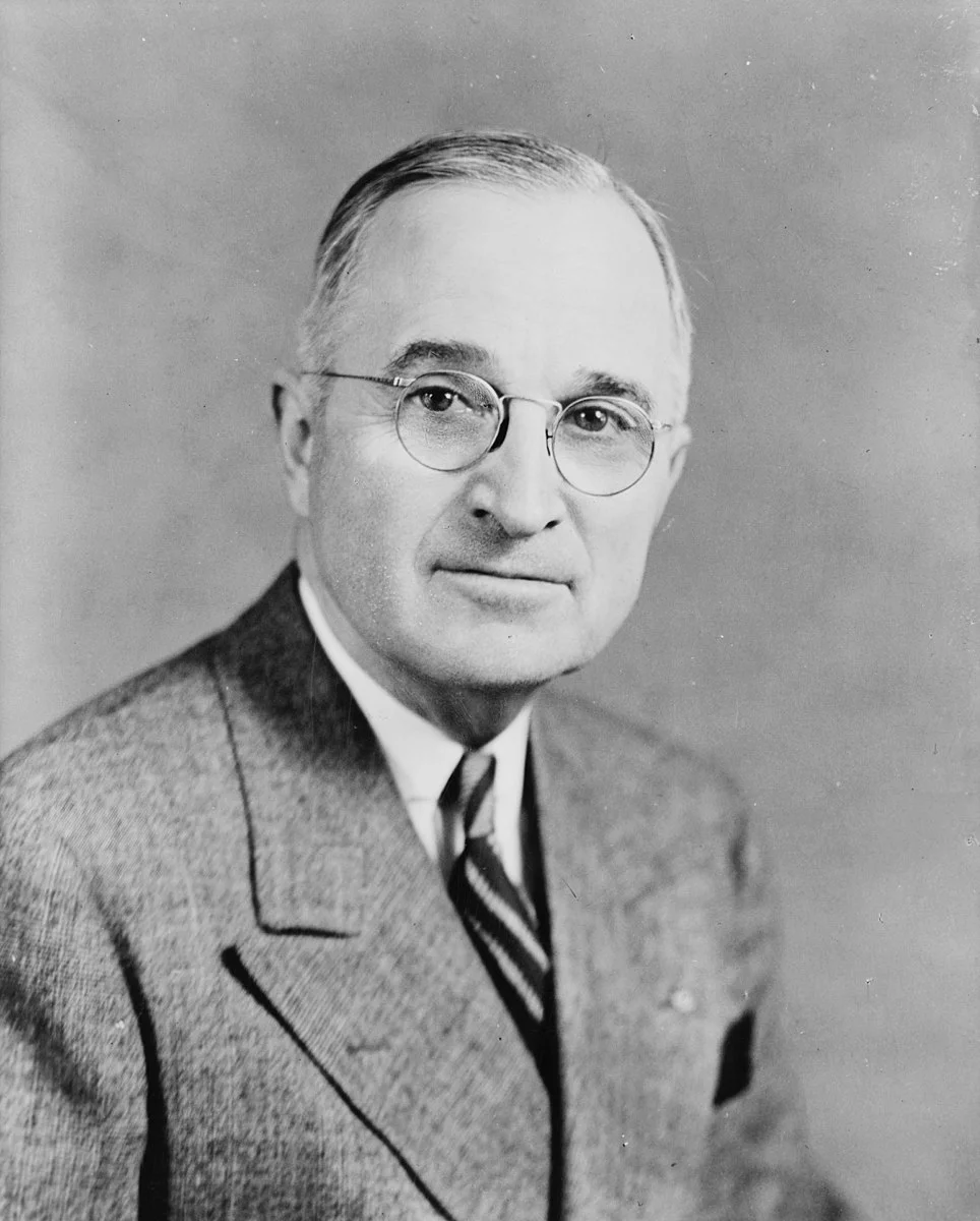 964px-Harry_S_Truman,_bw_half-length_photo_portrait,_facing_front,_1945.jpg