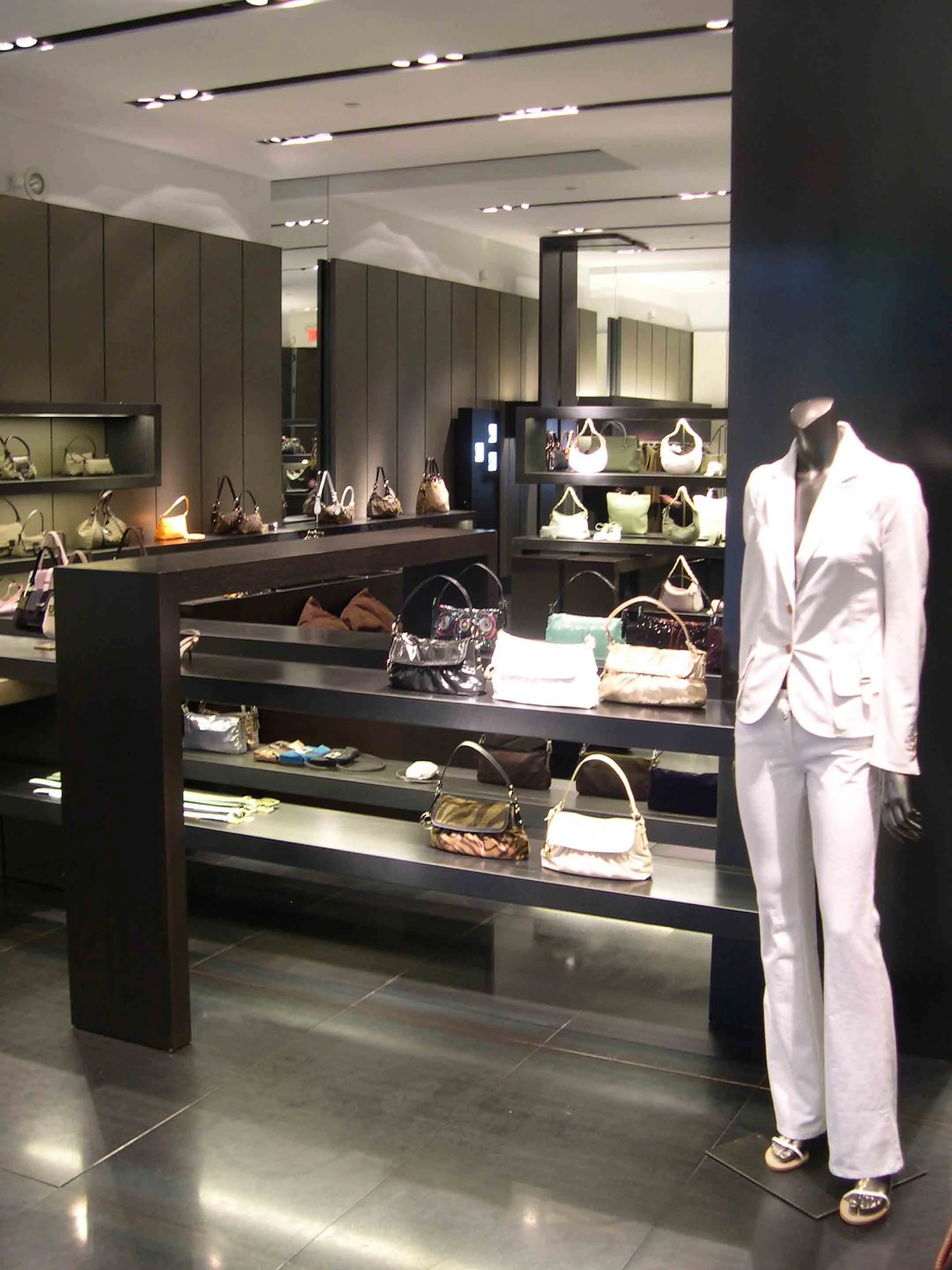  Bal Harbour, FL  Based on a prototype developed in Italy, the project involved the layout, design, and detailing of a complex set of overlapping display platforms within a minimalist store backdrop. The design goal was to create an atmosphere in whi