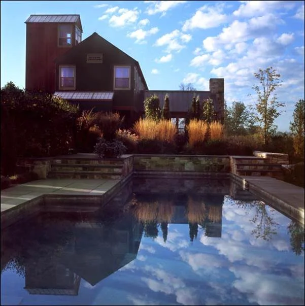 SUSTAINABLE FEATURES: -Active Solar (100% electric usage) -Passive Solar -Certified sustainable materials -Recycled materials-tiles, stones -Grey Water Recycling -Rainwater collection-cisterns -Passive air-conditioning -House designed on 4 grid to minimize construction waste