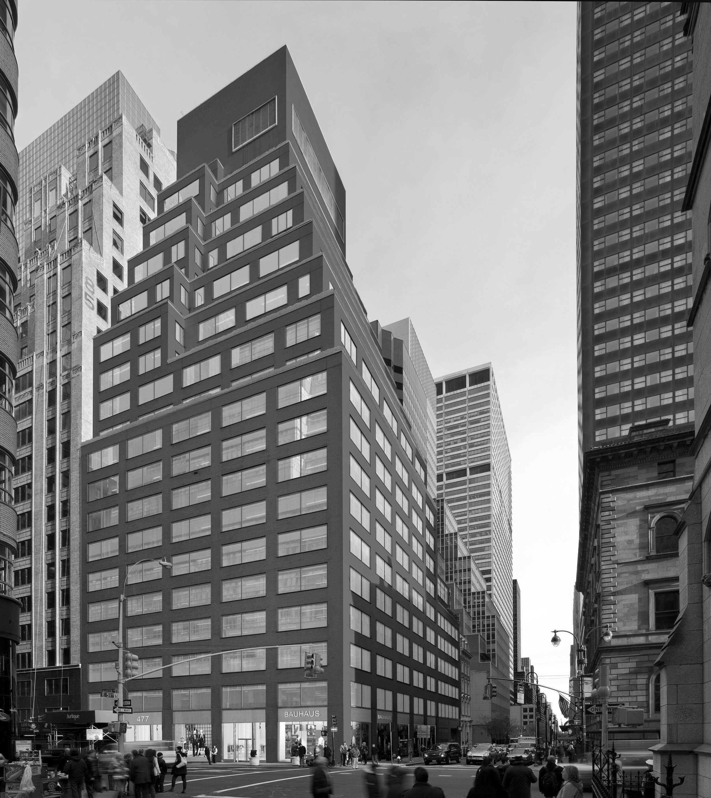  A distinctive canopy gives especially a small lobby the desired presence on the street.   At 477 Madison we raised the height at the entrance to insert a sleek stainless steel canopy. White glass paneled walls between the two sets of vestibule doors