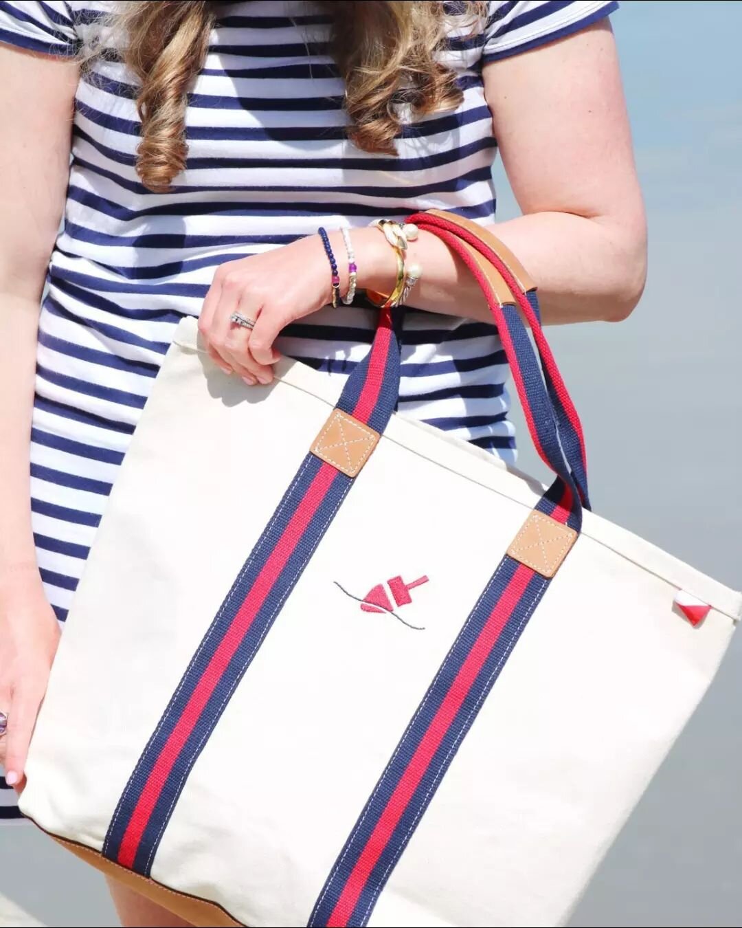 If you'll be on Peaks Island this weekend, be sure to stop by @takeapeak52 and check out our entire line of clothing and accessories - including our Picnic Point tote, shown here, styled by @shannonsalt&nbsp;🤩