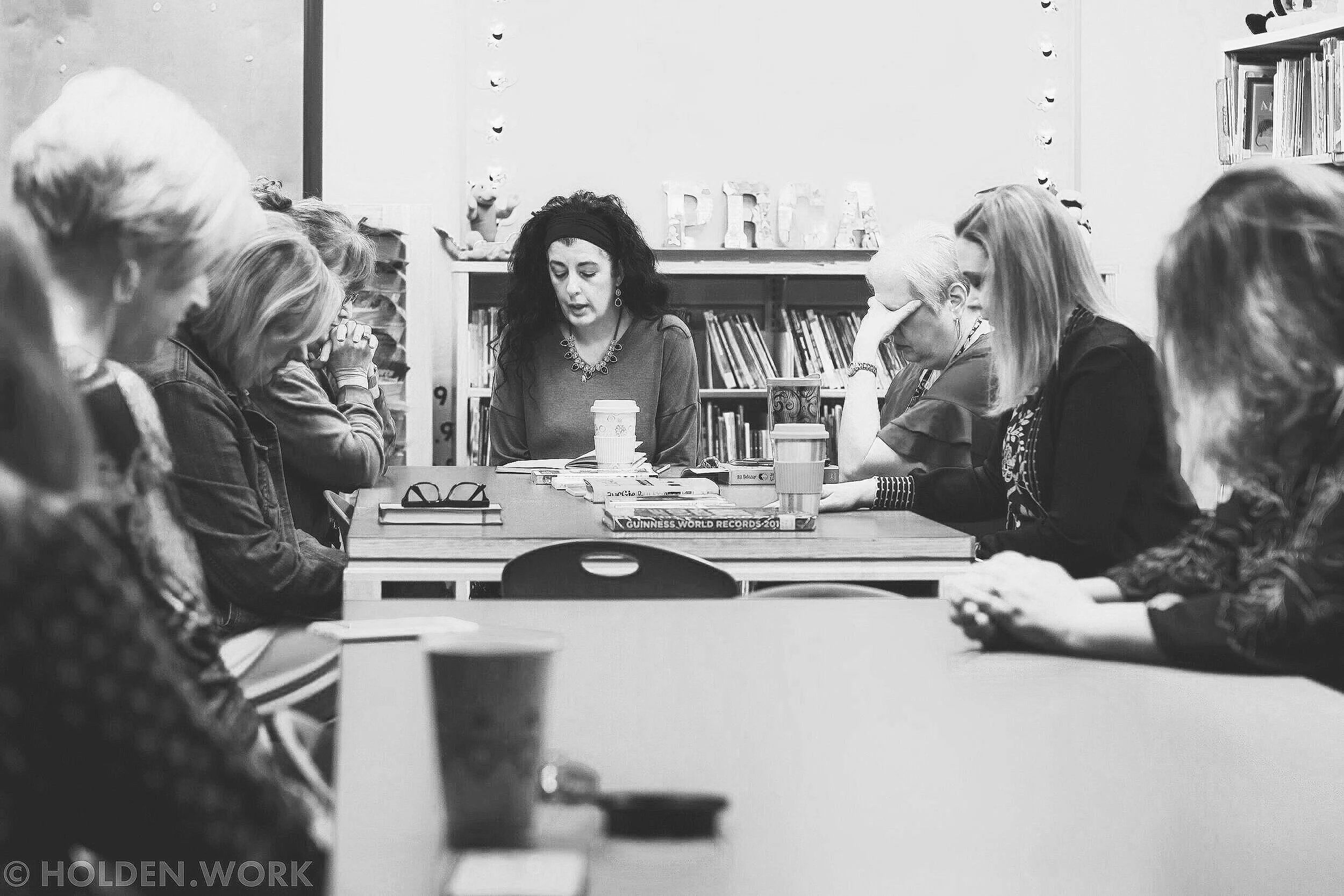 teachers praying together at Park Row Christian Academy